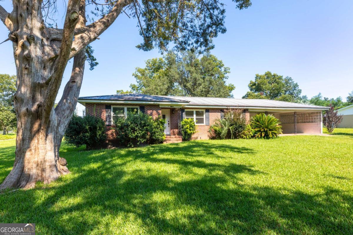 Charming 3 Bedroom, 2 Bath Home on Corner Lot - Updated and Move-In Ready! Welcome to this 3-bedroom, 2-bathroom home situated on a corner lot! Featuring new flooring throughout most of the home, this property offers modern touches with room to make it your own. The kitchen has been refreshed with newly painted cabinets and will be equipped with a brand new stove/oven range installed before closing-perfect for the home chef! The home also includes a large carport, providing ample covered parking and additional storage options. With its thoughtful layout, convenient location, and updated features, this home is a fantastic opportunity for anyone looking for a solid home with great potential.
