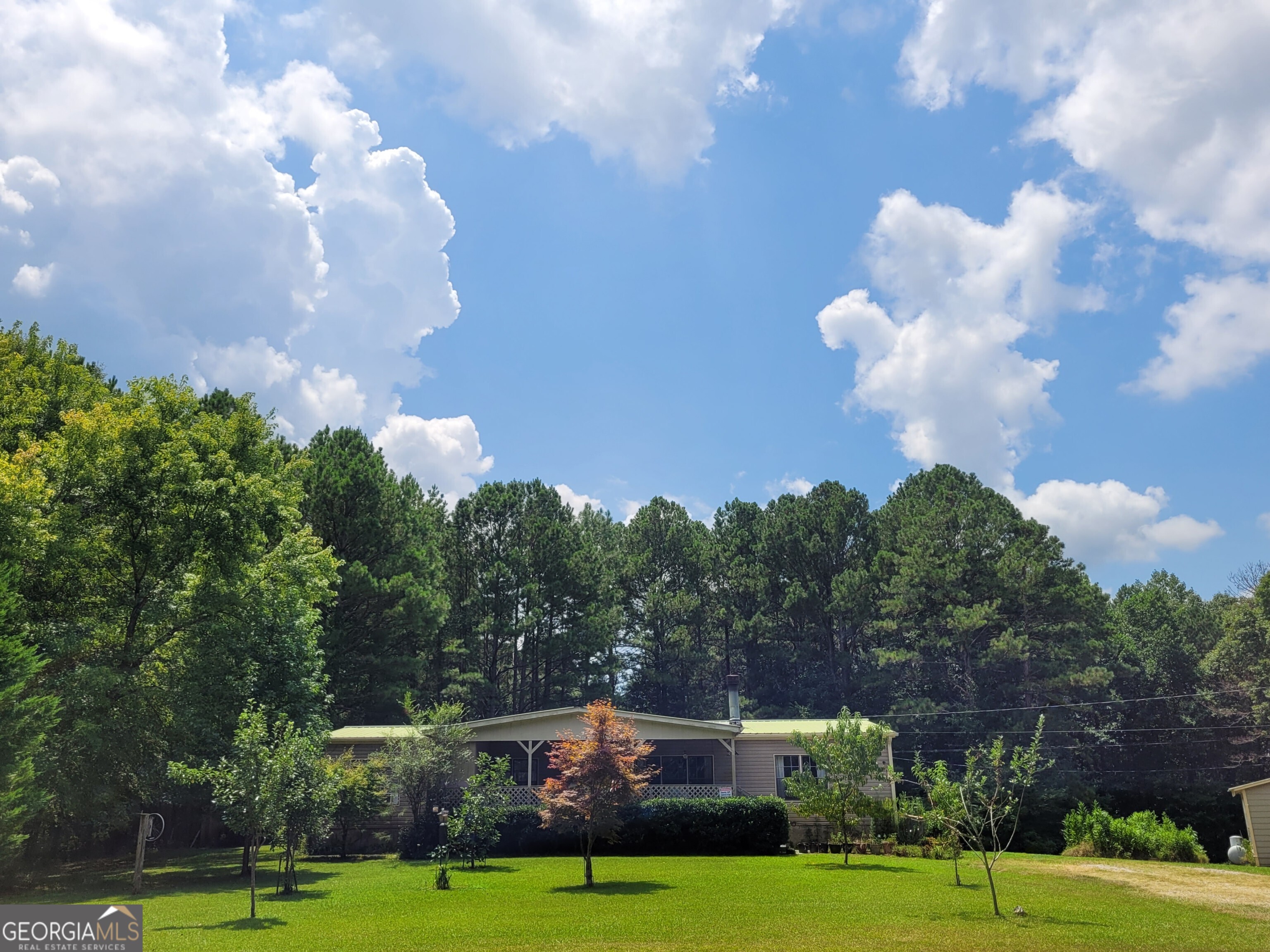 Charming Home-Dallas GA, minutes from 278, Discover this delightful 3 Bedroom/2 Bath single family home situated on approx 1 acre. This home features a spacious layout with large family room with rock fireplace, dining room, Master suite with soaking tub,rocking chair front porch, covered back screen porch overlooking above ground pool with lounging deck, perfect for family entertainment, Storage building, garden area. This property also has a seperate studio/teen suite or in law suite seperate from main house,with bath/shower/kitchenette. MUST SEE!