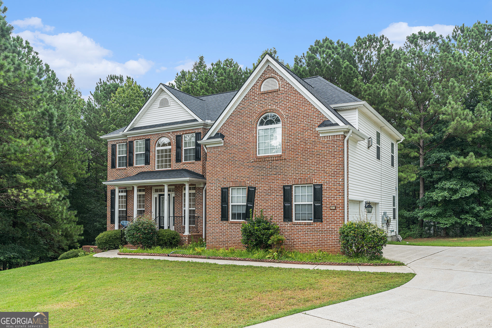 Nestled on a quiet cud-de-sac within the sought after Highland Park subdivision in Fayetteville, GA, this property offers spacious, executive-style living with across two levels. The home welcomes you with a dramatic two-story foyer leading to formal living and dining rooms, and flows into an open kitchen with breakfast bar and family room featuring a marble fireplace framed by a wall of windows. A convenient main-floor bedroom and full bath ideal for guests or a home office. Upstairs, four additional bedrooms include an expansive primary suite boasting a fireplace, sitting area with palladium window, custom closets, and a spa-style bath. This well-maintained home showcases hardwoods, tile, and carpeted floors, tray ceilings, gas logs fireplaces, and a newly installed roof. Outside, enjoy a private, wooded backyard and patio, perfect for relaxing or entertaining. Built in 2004, this distinguished property combines elegant design and modern comfort in a prime Fayette County location.