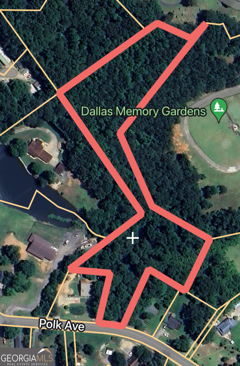 Welcome to this spacious building lot located in downtown Dallas. This lot features a little over 3 acres of a mixture of hardwoods and pines, paved road frontage, with water and power available for connection. Bring your builder to make your new construction dreams come to life. This lot gives you the quiet, country feel with the convenience of the town being so close. Tons of shopping and dining are just minutes away. Located within the Northside, Herschel Jones, and Paulding high school districts.