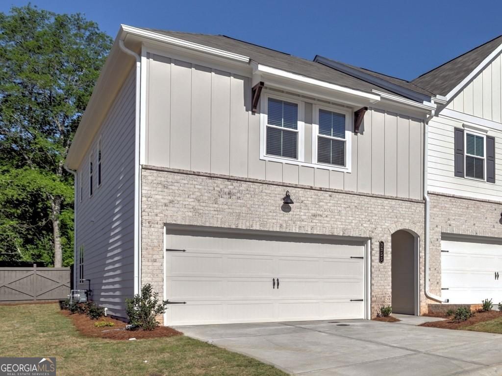 3355 Verdi Lane - This bright and airy "Like New" home features an open floor plan with a gourmet kitchen boasting white cabinetry, matte black hardware, quartz countertops, stainless steel appliances, a walk-in pantry, and a large island with seating for four+. The living room offers a cozy fireplace and ample space for relaxation, while the adjacent dining area is perfect for entertaining. Step outside to your private extended patio, ideal for unwinding and grilling. Durable LVP flooring runs throughout the home for easy maintenance. Upstairs, a versatile loft makes for a great office or sitting area. The spacious owner's suite fits a king-sized bed, features an oversized walk-in closet, and connects to a luxury bath with a tiled glass shower, double vanity, and tile flooring. The second floor also includes two large bedrooms, a hall bath, storage space, and a laundry room. A 2-car garage provides ample parking, and the home includes a refrigerator, washer, dryer, and landscaping services. East Park Village offers top-tier amenities, including a pool, cabana, and a dog park. Conveniently located just 1 mile from Downtown Kennesaw, I-75, and 2 miles from KSU, the home is within walking distance of restaurants, breweries, parks, and shopping. Zoned for North Cobb High School. With 24 month lease, the monthly rent is $2900.