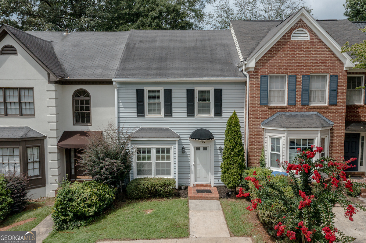 Welcome to this spacious townhouse located in the desirable Salem Woods community of East Cobb! This charming fee-simple community offers low association fees and move-in-ready features. As you enter the home, you will love the beautiful laminate wood flooring throughout, natural light from updated windows, and a relaxing backyard. The bathrooms and kitchen have been recently remodeled, adding a modern touch to this inviting space. The spacious living room with a cozy fireplace and dining room open concept leads to a private patio, perfect for outdoor entertaining. The dining room connects seamlessly to the galley-style kitchen with a breakfast area, and a convenient half bath is on the main level. Upstairs, you'll find two bedroom suites, each with a private ensuite bathroom and walk-in closets, along with a laundry room for added convenience. The property includes a driveway with parking for two cars, an attic that will surprise you, and a storage shed for extra storage in the backyard. Enjoy low-maintenance living minutes from I-75 and I-285 in the heart of shopping, entertainment, and a short drive from the Atlanta Braves Stadium. Don't miss this fantastic opportunity!