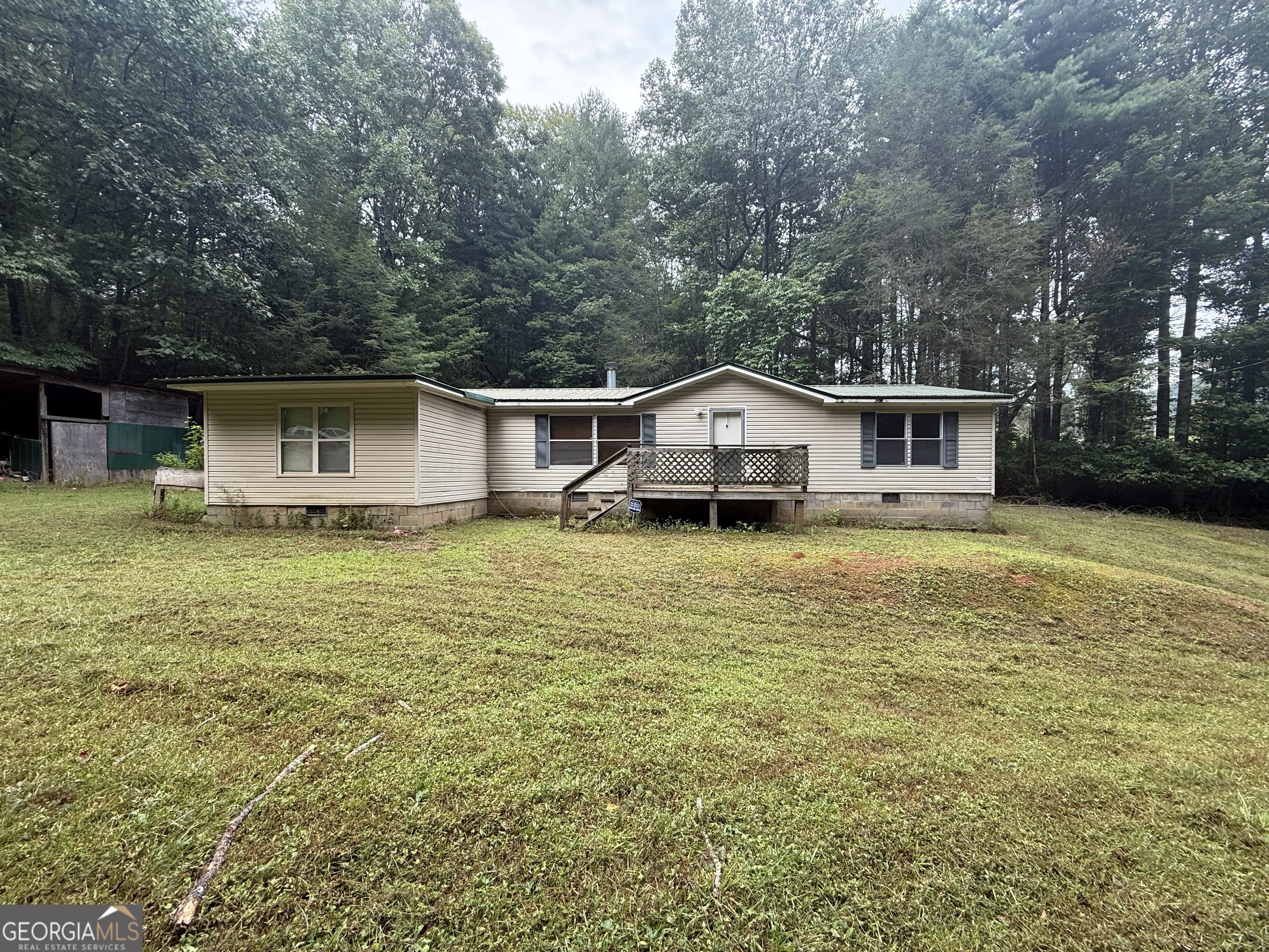 Investor's Dream! 2.94 Unrestricted Acres - Endless Potential! This versatile property offers 2.94 unrestricted acres, ideal for development, rental income, or expansion opportunities. Featuring a 3 bedroom, 2 bath home, including a newly remodeled master bathroom, this home blends comfort with investment potential. Whether you're looking to build additional structures, or enjoy spacious country living, this property is ready to deliver. SOLD AS-IS!