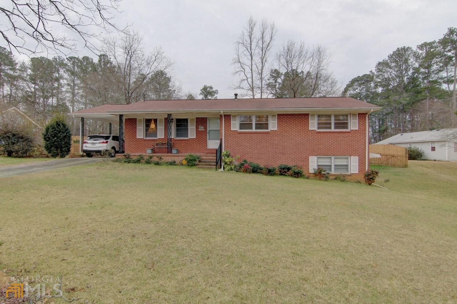 *BACK ON THE MARKET* Due to buyer's financing, their loss is your gain! - Great location!! You will love this four side brick ranch in walking/golf cart distance to Historic Downtown Covington! Close to Academy Springs Park. Large lot features fenced in backyard, screened back porch and storage shed. Finished basement has infinite possibilities. There is a kitchenette area with a sink plus full bathroom. Could be used as an in-law suite, craft, game or exercise room! Well maintained house has been well loved. Ready for you to move in and make some new memories.