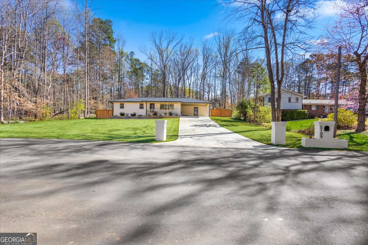 This is a must-see property - photos don't do it justice. Located in the heart of Sugar Hill, just 5 minutes from downtown and 15 minutes from Lake Lanier, this home is a true standout. This is not your standard renovation. The house was fully stripped to the studs and rebuilt using top-quality materials throughout. Every major component has been updated: All-new moisture-resistant Level 5 drywall New electrical and plumbing systems New roof, subflooring, and interior flooring Brand-new HVAC system with updated ductwork Both the attic and crawl space have been spray-foam insulated to enhance energy efficiency year-round. The kitchen has been completely reimagined with solid wood cabinetry, quartz countertops, and a sleek tile backsplash. Bathrooms are finished with marble counters and flooring, modern fixtures, and anti-fog LED mirrors. Outside, the front and back yards have been professionally landscaped. A brand-new cedar privacy fence encloses the backyard, which also features a custom-built shed with a concrete foundation-ideal for extra storage.