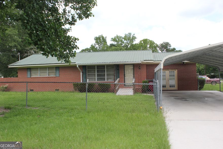 LOOKING FOR A GREAT FIXER UPPER!! 2 Bedroom, 1 Bathroom, Approx. 1584 SQFT, All Brick, Enclosed Garage Area Could Be A 3rd Bedroom, Located on .23 Acre Lot, Fenced Yard, Portable Carport, Lots of Potential for This Home.