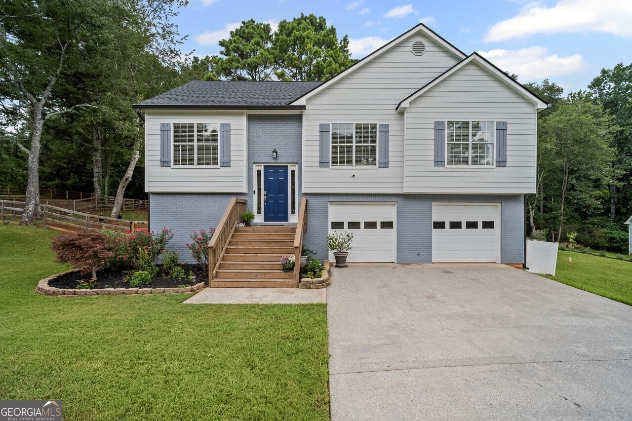 Welcome to this beautifully maintained, move-in ready home on a rare .9-acre corner lot with no HOA! This property offers the perfect blend of privacy and convenience, all just roughly 10 minutes from Downtown Woodstock, Hwy 92, shopping, dining, and parks, including the soon to be Little River Park only 5 minutes away.Inside, you'll find thoughtful updates throughout. The bright family room features soaring ceilings and abundant natural light. The open-concept kitchen shines with updates done in 2024 including quartz countertops, a double sink and touch-free faucet, induction range, vented hood system to outside, backsplash, and upgraded lighting. The spacious primary suite boasts large double windows for plenty of morning sunshine. A generous storage room sits conveniently beside the laundry room, and the two-car garage still leaves ample space for hobbies or a workshop. Major updates provide peace of mind: a brand-new HVAC system with ducting (May 2025), new roof (June 2025), exterior and interior paint (July 2024), plus new gutters and downspouts with leaf guards. Step outside and enjoy your morning coffee on the covered deck, rain or shine, while watching deer and birds in the huge fenced backyard. The fenced backyard has been extended which includes a large shed with power and water, and the front yard has been beautifully freshly landscaped. Whether it's relaxing on the deck, gardening, or enjoying the quiet surroundings, this home offers both comfort and lifestyle, all with the freedom of no HOA.