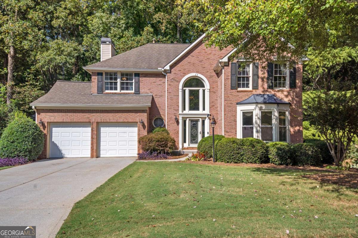 Welcome Home to Windward - Where Everyday Living Feels Like a Getaway This well-maintained home, part of the wonderful Windward community, offers the perfect blend of comfort, convenience, and community. Located just minutes from Downtown Alpharetta, Halcyon, and Avalon, and zoned for top-rated schools, it's an ideal spot for anyone looking to enjoy all that North Fulton has to offer. Inside, you'll find 4 bedrooms, 3.5 baths, and a finished terrace level with flexible space for a media room, gym, or home office. The main level features travertine flooring, a spacious dining room, and a kitchen with granite countertops, tumbled marble backsplash, and plenty of cabinet space. The family room is open and inviting with hardwood floors, a brick fireplace, and built-in speakers. Step into the vaulted sunroom and enjoy peaceful views of the wooded backyard and a creek-your own private slice of nature. Upstairs, the Owner's Suite includes a tray ceiling and a private bath with a whirlpool tub and separate shower. Three additional bedrooms share a beautifully updated bathroom with granite finishes. The terrace level adds even more living space, including a second fireplace, a flex room, and a full bath with dual rain shower heads. But what truly sets this home apart is the Windward lifestyle. Residents enjoy access to 20 tennis courts, four swimming pools, pickleball courts, and miles of walking trails. Spend weekends at the 195-acre lake with fishing piers and a watercraft launch ramp, or join the Windward Lake Club and the Golf Club of Georgia for even more recreation and social opportunities. With a near-level driveway, mature landscaping, and easy access to shopping, dining, and major highways-without the traffic noise-this home offers everything you need in a location you'll love. Come see why Windward is one of Alpharetta's most desirable communities. This home is ready for its next chapter-make it yours!
