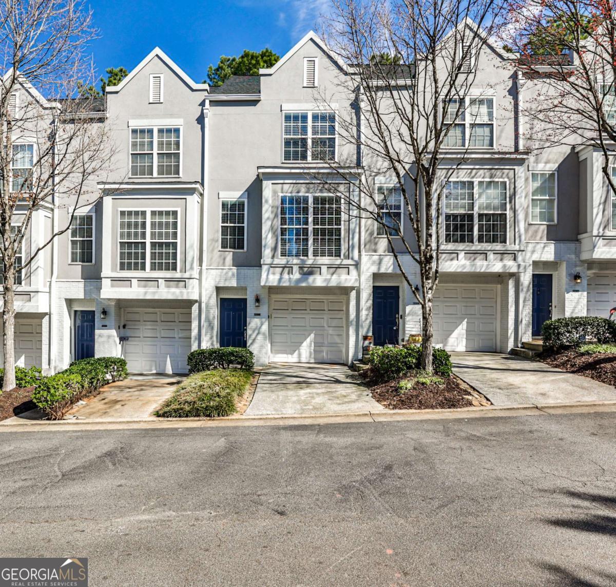 Welcome to your dream townhome in the heart of East Atlanta Village! This spacious 2-bedroom, 2-full bath, and 2-half bath residence is the largest home in the complex, offering an abundance of light and room to live and entertain. Step inside to discover a beautifully updated kitchen featuring stone countertops, perfect for culinary enthusiasts. The versatile office space adds flexibility to your lifestyle, whether for work or leisure. Enjoy the convenience of a one-car garage and the peace of mind that comes with living in a gated community. Relax in your true backyard, fully fenced for privacy and ideal for outdoor gatherings or tranquil evenings. Residents also have access to a community pool, perfect for those warm Atlanta days. Freshly painted and move-in ready, this townhome is a must-see! Don't miss your chance to make it yours. Schedule a showing today! Images are virtually staged.