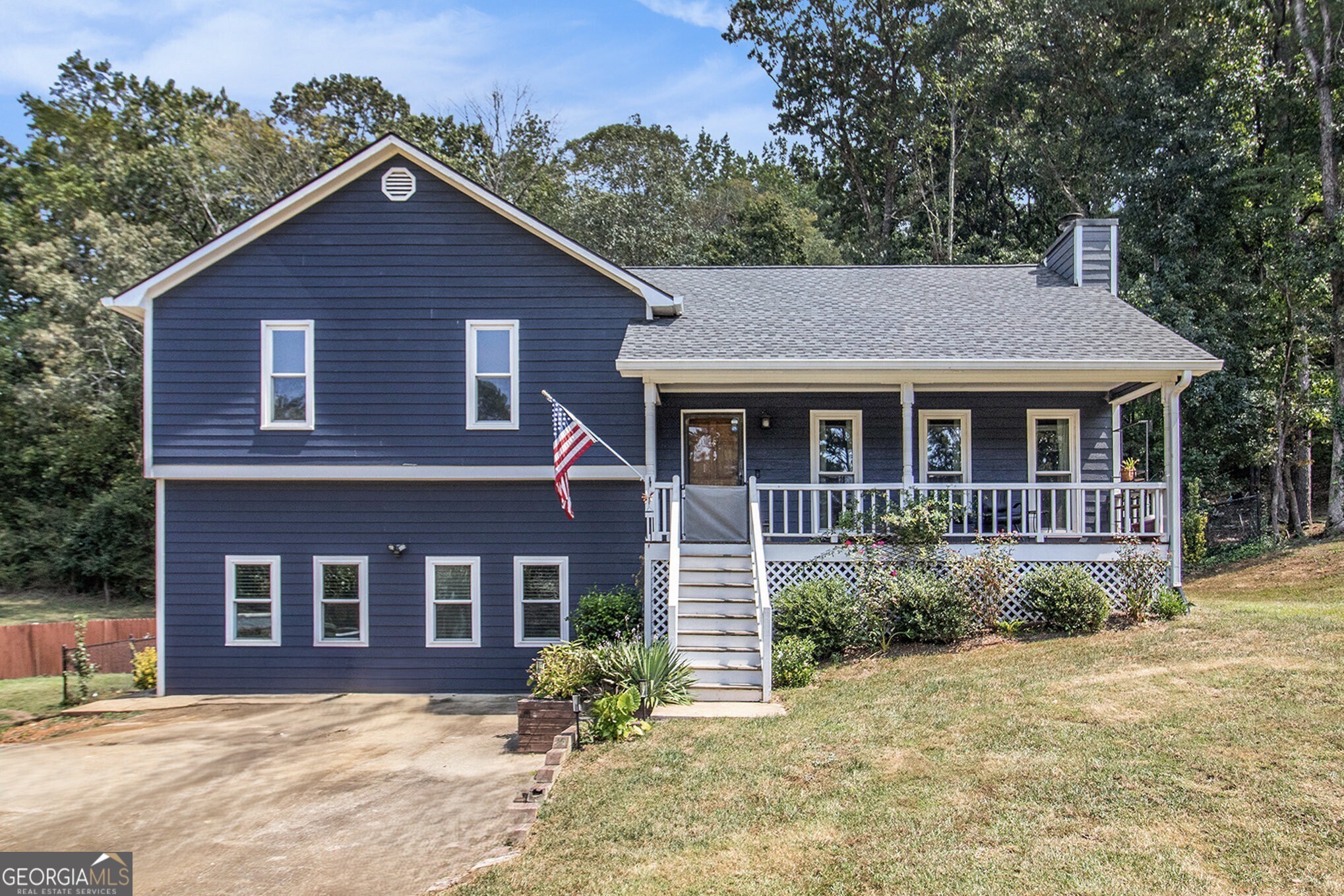 Charming Split-Level in Spencer Place, Douglasville! This delightful home sits on nearly half an acre in an established neighborhood and features a Separate 1 Bed/1 Bath In-Law Suite Apartment with its own entrance perfect for extended family or income potential. Step onto the Rocking Chair Front Porch and take in the landscaped yard before heading inside to a Bright and Open Floor Plan. Hardwood Floors, Crown Molding, and a Marble Fireplace create a welcoming Family Room filled with Natural Light. The adjoining Dining Room is ideal for entertaining and flows seamlessly into the Kitchen. A door opens to the Screened-In Porch, an inviting spot for Game Day gatherings, year-round Al Fresco Dining, or simply relaxing. Upstairs, the Primary Suite offers a Walk-In Closet and Private Ensuite Bath, while Two Additional Bedrooms share a Full Bathroom. The Fully Finished Daylight Terrace Level extends the living space with a Complete Apartment/In-Law Suite. Enjoy a Brand-New Eat-In Kitchen with Stone Countertops and Stainless Steel Appliances, a Spacious Living Area with Custom Built-Ins and a Gas Fireplace, plus a Full Bathroom with Stone Vanity and Tub/Shower Combo. This versatile space is ideal for guests, multigenerational living, or rental income. The Large, Fenced Backyard provides plenty of room to play, garden, or host outdoor fun. All this in a Peaceful Neighborhood just moments from downtown Hiram, Dallas, and Douglasville close to Shopping, Dining, and Recreation, with Easy Access to Major Highways for a smooth commute. Don't miss your chance to call this Beautifully Maintained Property your Forever Home!