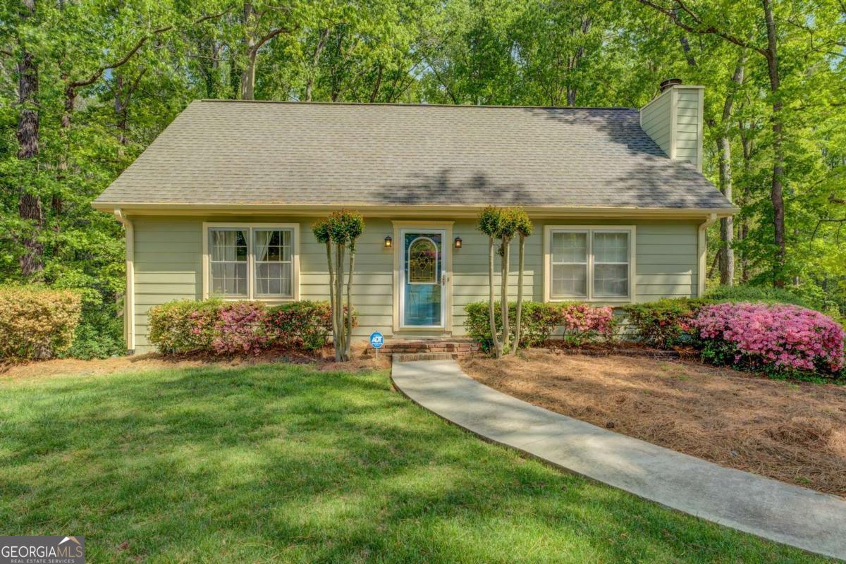 Welcome to this well-maintained 4-bedroom, 2-bath home located in growing and conveniently located Conyers! This versatile floor plan offers two bedrooms on the main level-one serving as the primary suite and the other perfect for an office or guest room, complete with a full bath. Upstairs, you'll find two generously sized bedrooms that share a full hall bath. The heart of the home is the eat-in kitchen, thoughtfully designed to overlook the back deck, yard, and a peaceful creek-ideal for morning coffee or evening gatherings. A spacious unfinished basement provides excellent storage and houses the laundry area, offering plenty of potential for future expansion. Enjoy the beauty of mature landscaping and vibrant flowering annuals that come to life each spring. The septic system was recently serviced, and all major home systems have been professionally maintained for your peace of mind.