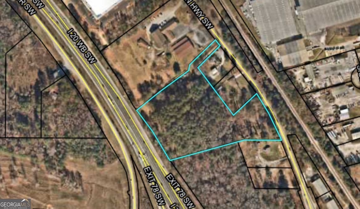 We present to you an exceptional investment opportunity in Conyers, GA: an approved and zoned industrial lotperfect for multiple business ventures. Strategically located just 3 minutes from the I-20 exit, this property offers high profitability potential. Business Opportunities: Car and truck dealerships Warehouse and distribution center development Truck and fleet parking Data center development Key Features: 80% cleared land, ready for development Full infrastructure: electricity, storm drainage, lighting, and perimeter fencing Office and service shop for truck maintenance Strategic location in a secure, high-growth area If you're looking for a secure and profitable investment, this property is your perfect opportunity! For more details or to schedule a visit, contact us today.