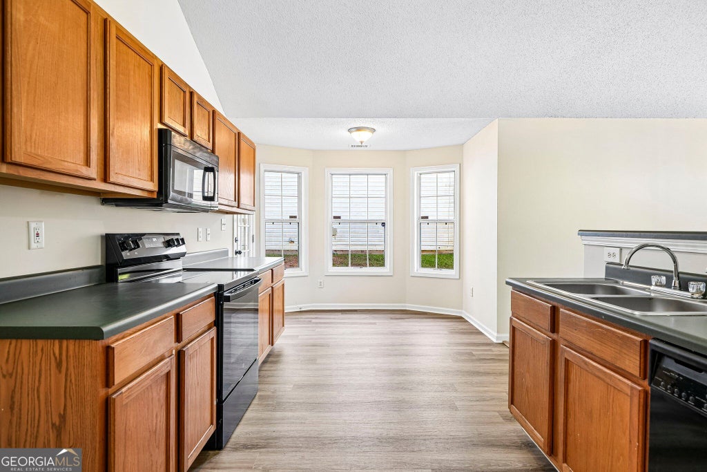 Photo of 7121 Ravenwood Lane, Lithonia, GA 30038 (MLS # 10881633)