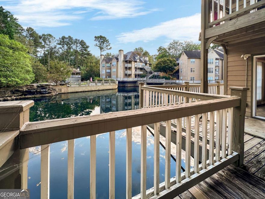 Experience the appeal of 606 Mill Pond Drive SE, a stylishly updated condominium in the sought-after Mill Pond Village community of Smyrna, Georgia. Renovated just a couple of years ago, this home offers modern touches including eco-friendly upgrades, luxury vinyl plank flooring, updated appliances, granite countertops, and refreshed bathrooms-making it a standout in the neighborhood.    Once showcased as a model home, this inviting residence features an open-concept layout with a cozy fireplace, a kitchen with solid-surface counters and a breakfast bar, and plenty of natural light throughout. The spacious primary suite includes a double vanity and a tub/shower combination, while the versatile second bedroom is ideal for guests or a home office. Unique to this home is its wrap-around deck-one of the few in the community-providing a serene outdoor retreat.    Residents of Mill Pond Village enjoy access to excellent amenities, including a fenced pool, tennis courts, and picturesque pond views. With its prime location near top-rated schools, shopping, dining, and major highways, this home blends modern comfort with everyday convenience.