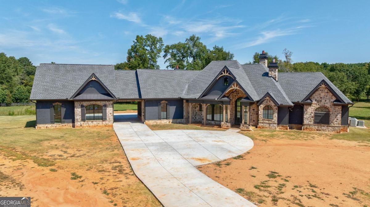 Stunning New Construction Home on 25.76 Acres in Morgan County with Pool, Barn, and Guest House. This beautiful, brand-new home is ready for you to personalize! Situated on 25.76 sprawling acres in picturesque Morgan County, this property offers the perfect blend of luxury, privacy, and potential. With ample space and room to grow, this home is a dream come true for those seeking a peaceful country lifestyle while still being within easy reach of Down Town Madison. The spacious home features an open floor plan with high ceilings and large windows, bringing in natural light and showcasing the gorgeous surrounding landscape. This home is being sold "as is", allowing the buyer the unique opportunity to complete and select their own flooring, tile, paint colors, and appliances to make the home truly their own.allowing the buyer the unique opportunity to select their own flooring, tile, paint colors, and appliances to make the home truly their own.
