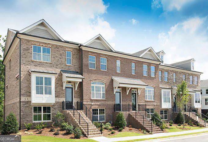 Agents do not show...please park in front of unit, third exit at roundabout to townhome on right, provides plenty of parking at your front door for visitors-no walking around the building!!!!! Welcome to this lovely townhome in sought after gated community of The Towns at East Village. Sophisticated open floorplan offers 3 Bedrooms & 3.5 Baths. As you enter, the finished Terrace Level features a Bedroom w/recently remodeled Full Bath, and access to the attached 2 Car Garage. Upon entering the Main Floor, note the sunlit kitchen w/ White Painted Cabinets, Granite Countertops, Illuminated Peninsula, Under Cabinet Lighting, & Stainless Steel Cooktop, Oven, Dishwasher, & Microwave. The Kitchen overlooks the Dining Area & Large Living Room. This room has a FPLC w/Gas Logs, Ceiling Fan, & Custom Cabinetry flanking the FPLC. There is a Powder Room on this level along with a Sunroom/Office Flex Space which adjoins the Living Room and Deck. Upstairs you find a 2nd Bedroom & Private Bath, Laundry Closet, & a Spacious Master Suite with Trey Ceiling, Two Walk-in Closets, Double Vanities, Oversized Shower, & Water Closet. The home features Hardwood Floors on Terrace & Main Level. Window Blinds are throughout & lots of closets for storage. Shows like a Model Home! The Towns at East Village offer a convenient location minutes to shopping, restaurants, schools, parks, 400, Downtown Roswell, Peachtree Industrial, Chattahoochee River Parks & Trails. ***Tax Bill reflects both City and County Taxes