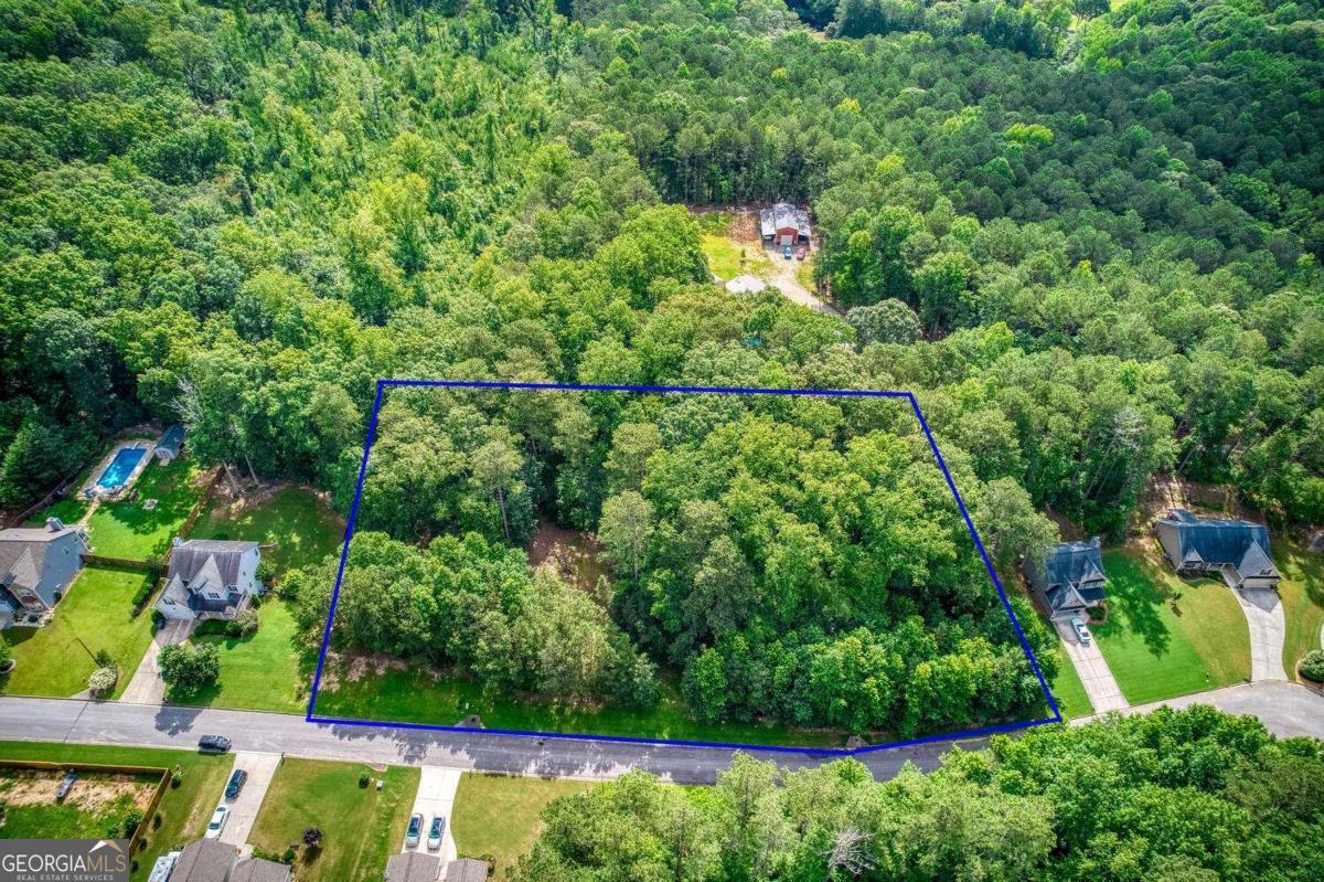 Bring your builder for this super piece of land in Henderson Ridge Subdivision in Dallas GA, located in the South Paulding High School District, this piece of land is 3 lots combined for a total of 1.74 acres with a great area to build a home, and plenty of leftover land for toys and parking! Curbs are in place, electrical and water on the street, you will need to put in your septic system. Sellers can close quickly and are open to offers. Come take a look and let's make a deal, schedule your walk-about with your agent