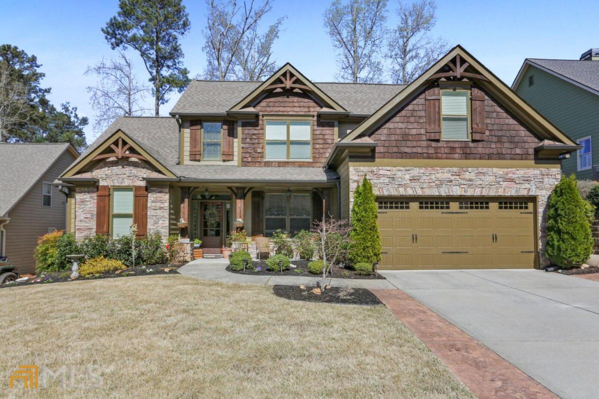 Welcome home to this beautiful, custom-built, craftsman style open floor plan. From the moment you step into this well maintained home, you will notice the upgraded details including Upgraded trim, can-lighting, granite in all bathrooms. hardwood floors, and all the designer touches. Expanded Island kit w/granite with plenty of room for all of your entertaining, stainless appliances, open to great room w/stone fireplace & vaulted ceiling; iron spindles on stairs. Large primary on main w/trey ceiling /ceiling fan, Welcoming 2 story foyer, spacious & light filled formal DR. Large secondary bedrooms up. Upper level bonus room is ideal for media room or flex space, and comes complete with separate heating/cooling system. Screened in porch & patio in fenced backyard with garden and fireplace for expanded entertaining space. This gem is conveniently located with easy access to I-75. I-575, shopping, dining, entertainment, and so much more!aLocated off Hwy 92 with easy accessibility to all that both Acworth and Woodstock have to offer. Move-in ready and priced to sell as property rarely comes available in this neighborhood.