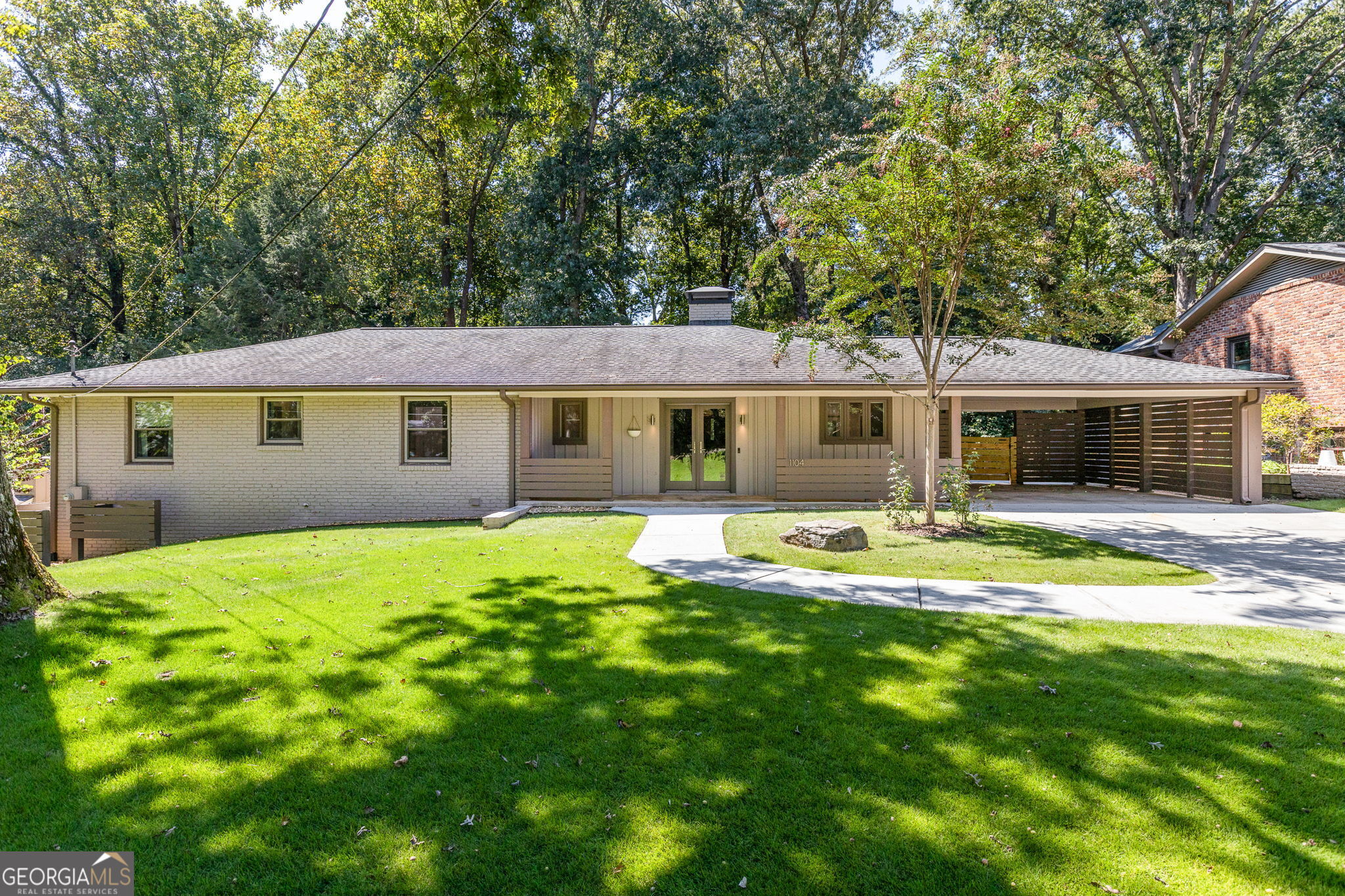 1104 Mason Woods Modern Mid-Century Living with Seamless Expansion This beautifully updated and expanded four-bedroom, three-and a half bath mid-century modern sits on a large, level, landscaped lot filled with sun, grass, and tranquility in desirable Mason Woods. The home offers an open floor plan, abundant natural light, hardwood floors, and effortless flow between upstairs and downstairs spaces. The main level features a gorgeous primary suite with oversized spa bathroom and walk-in closet, plus two secondary bedrooms and an en suite, and stylish hall bath. Living and dining areas connect to a modern kitchen and a screened porch overlooking the backyard, creating a perfect setting for everyday living and entertaining. The newly finished basement lives like a true extension of the home, with hardwood floors, a second den, full kitchen with walk-out patio, and a spa-like bath. A service window to the yard makes entertaining a breeze, while flexible design allows the level to function as an in-law suite, au pair suite, or guest retreat. The deep backyard expands the living space outdoors, while the thoughtful layout ensures every inch of the property is usable, connected, and private. Unbeatable Location: Minutes to Emory, CDC, CHOA, and Toco Hills shopping and dining, with quick access to downtown Decatur. Nature lovers will appreciate nearby Lullwater Preserve, Candler Lake, and WD Thompson Park. A rare opportunity to own a home that combines modern design, flexible living, and a premier location, all in one.
