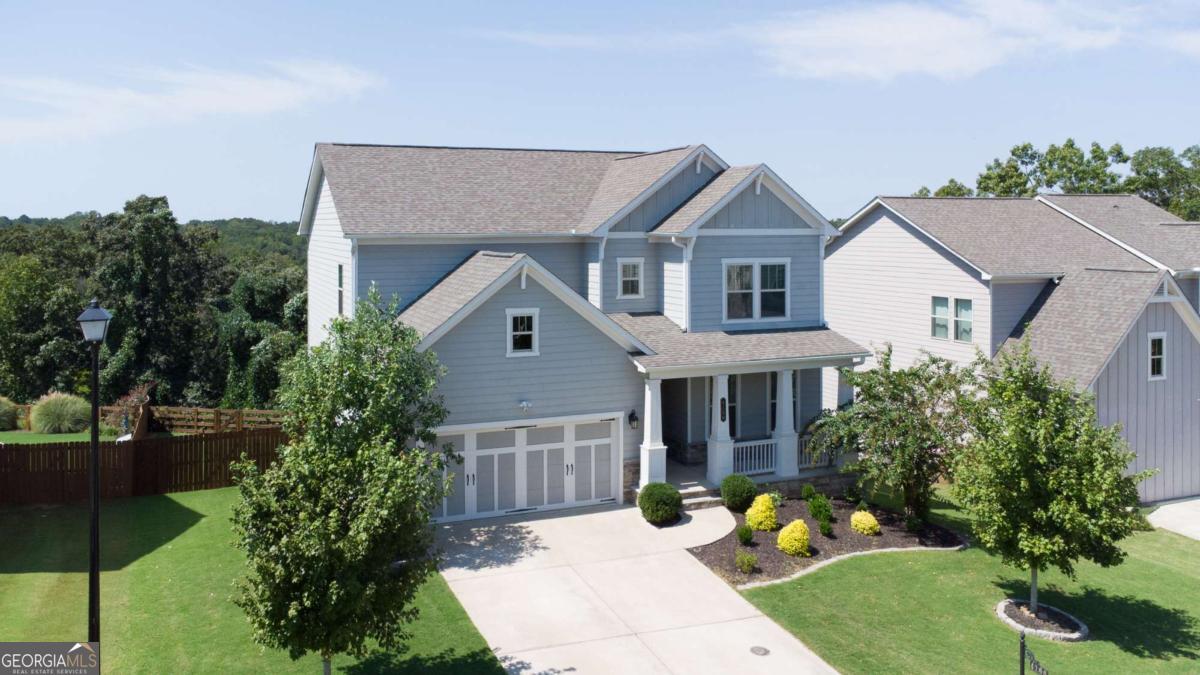 YOU MUST SEE this home! It perfectly balances modern style with warm, inviting comfort. Situated in the highly sought-after Forsyth County School District, this east-facing residence is filled with crisp, bright natural light that makes every room feel open, fresh, and welcoming. Inside, the thoughtful design and meticulous care shine throughout. Each space has been maintained with exceptional attention to detail, offering a move-in ready home you'll be proud to call your own. The fully finished basement adds versatility for entertaining, hobbies, or additional living, while the brand-new covered decks both upper and lower, expand your living space outdoors to enjoy year-round. Set in a prime location close to shopping, dining, and commuter routes, this home offers the best of convenience, community, and charm. Here, you'll find not just a house, but a lifestyle.