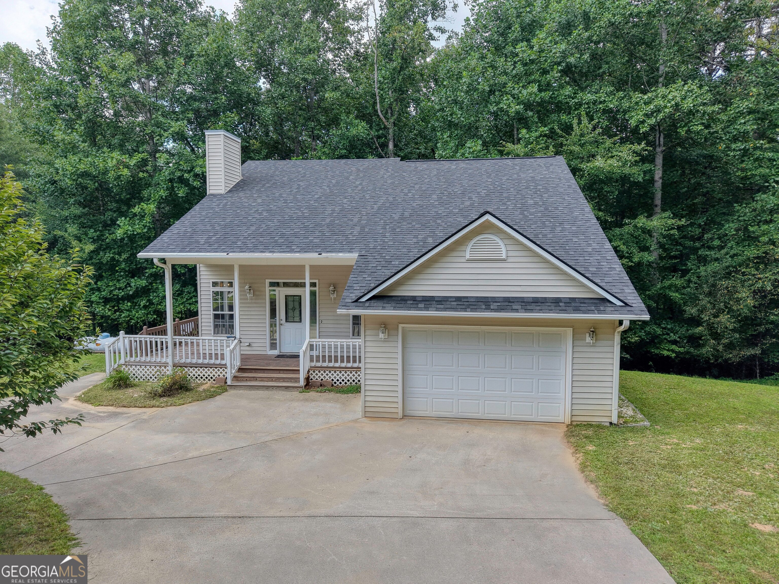 Ideally situated less than two miles from downtown Blairsville and in close proximity to Union General Hospital, this thoughtfully designed home offers an open, light-filled floor plan with soaring cathedral ceilings and a striking stone fireplace in the main living area. Bedroom suites with full baths are located on both the main and upper levels, providing comfort and flexibility. The full, partially finished basement-stubbed for a bath-presents an opportunity for additional living space or a third bedroom. With an attached garage, abundant storage across all levels, updated roof and HVAC, low-maintenance vinyl siding, and access to high-speed fiber internet, this home blends convenience, space, and modern efficiency.