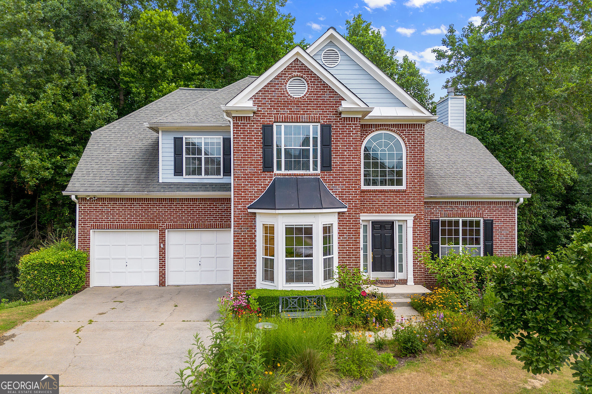Welcome Home! Step into this warm and inviting 4-bedroom, 2 full bath, and 2 half bath residence where comfort meets functionality. A two-story foyer welcomes you with abundant natural light, setting the tone for the beautiful hardwood floors that flow throughout the main level. The spacious eat-in kitchen opens seamlessly into a cozy family room with a fireplace-perfect for both quiet nights in and lively gatherings. Just off the garage, you'll find a generous laundry/mudroom, ideal for organization, storage, and everyday convenience. Upstairs, the oversized primary suite is a true retreat, complete with a charming sitting area-your perfect place to relax and unwind. The bright, expansive basement offers endless possibilities: a media room, home gym, playroom, or entertainment hub, all with ample storage throughout. Don't miss this incredible home that blends space, style, and convenience. Schedule your showing today!