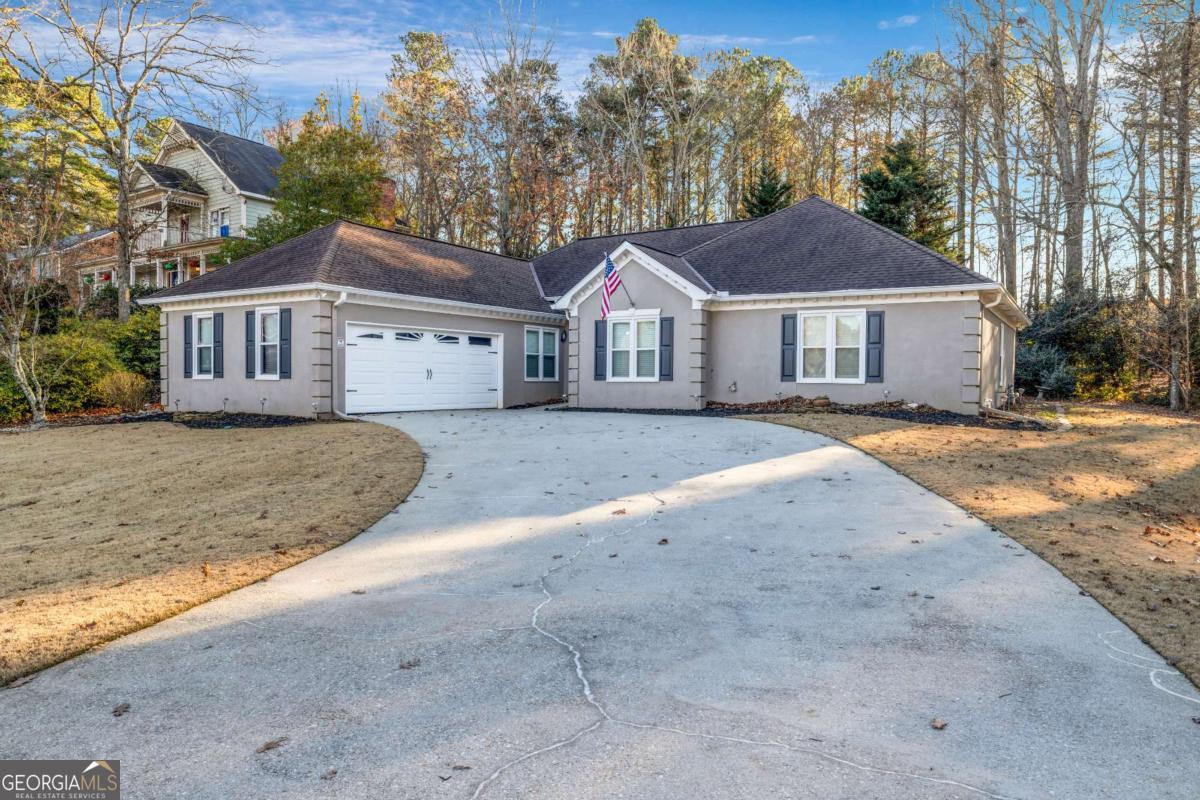 RENOVATED RANCH in Buford!! Seckinger School District! It Features 3 bedrooms and 2.5 bathrooms. It has been remodeled, upgraded & updated! Granite counters & tile flooring in kit & all baths. Large Kitchen with Breakfast Bar, island, eat-in area, pantry, 5 burner gas range & tons of counter space. Large Master suite with accent walls Design, Master bath with soaking tub & frameless shower door. Family Room with Fireplace, NEW paint in & out, windows & roof (2015), plantation blinds, high efficiency Trane HVAC. Don't Miss This Opportunity.