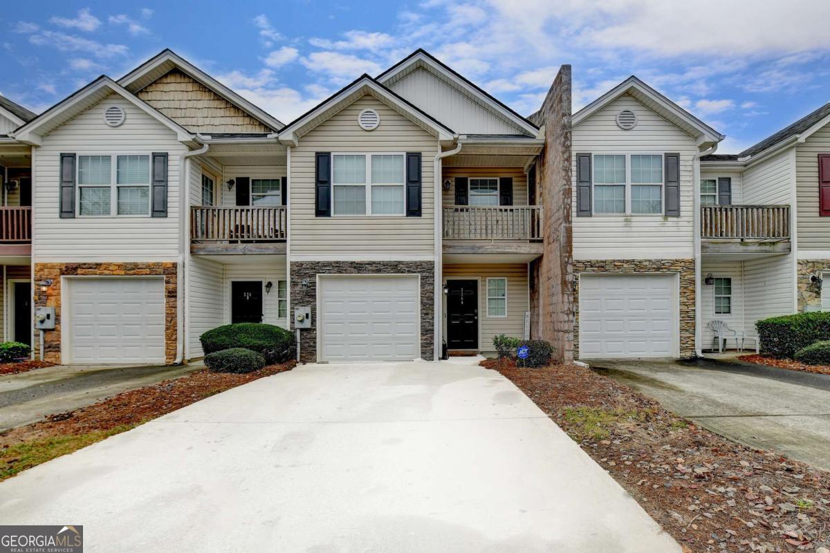 Step into this beautifully updated 3-bedroom, 2.5-bath home featuring a brand-new roof, luxurious LVT flooring, elegant stone countertops, and top-of-the-line appliances-all included! The spacious upstairs primary suite offers a sleek en suite bathroom with a large walk-in shower and access to a private balcony. Two additional bedrooms provide ample space for family, guests, or a home office. Don't miss your chance to own this turnkey gem!