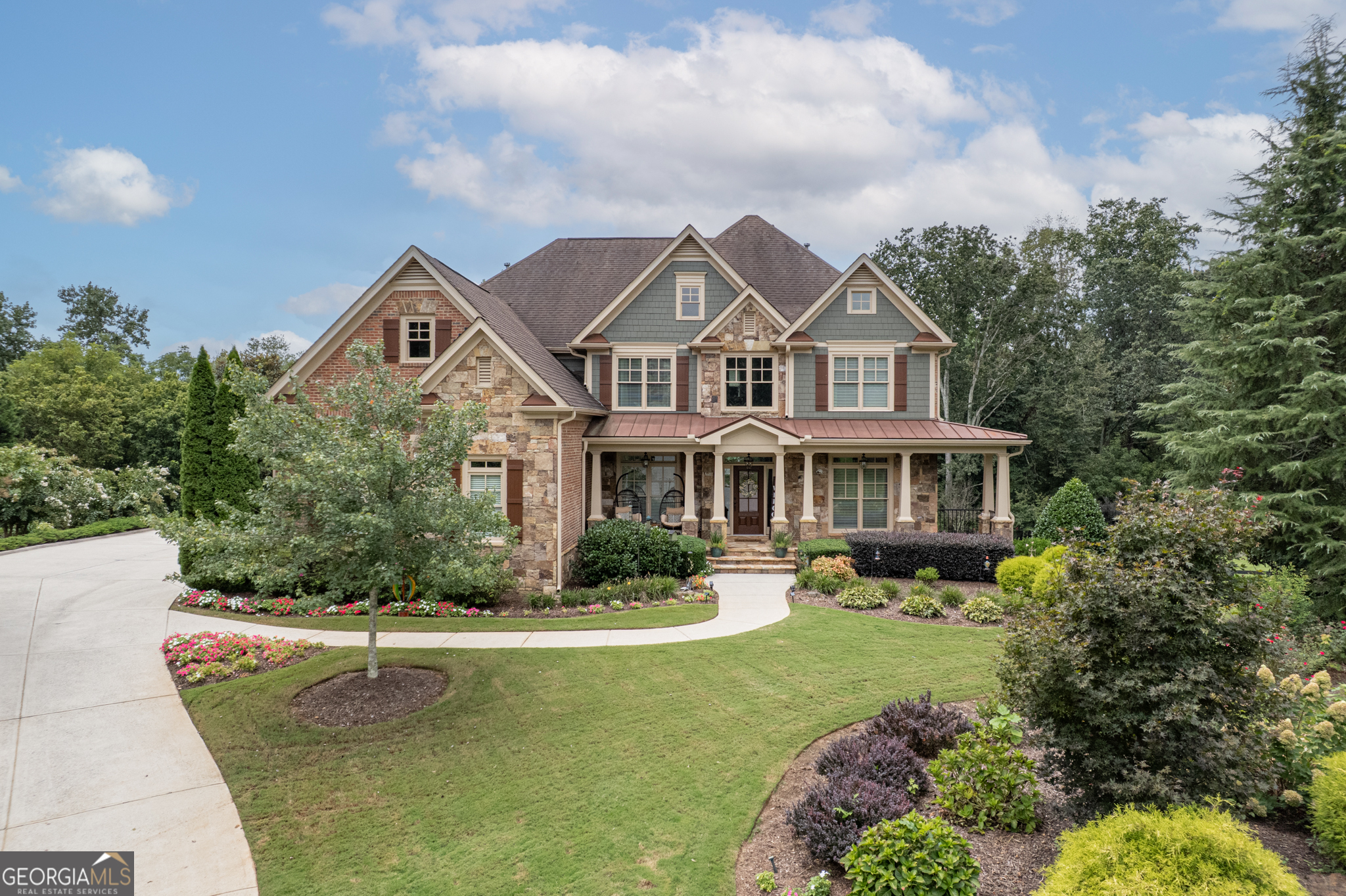 Luxury and lifestyle converge in this meticulously maintained 5BR/4.5BA, 3-car garage Lake Forest home, nestled on a 1.65-acre cul-de-sac lot-one of the largest and flattest in the community. Features include: refinished hardwoods, gourmet kitchen with oversized island (wine fridge-ready), two gas-starting wood-burning fireplaces, and fresh paint inside & out. The expansive flagstone rocking chair front porch welcomes you HOME! The main level offers a dedicated office, large dining room, keeping room, half bath, family room with built in's, and a spacious guest bedroom with adjacent full bath. Upstairs: The spacious layout includes a grand primary suite with sitting area, spa-like en suite bath, and enormous closet space. An additional en suite bedroom offers privacy for guests or family, while the remaining two bedrooms share a Jack-and-Jill bath. Large flex space for game room or private living space completes the upstairs. Outdoor living at its best with a large deck, large flat fully fenced back yard, flagstone fire pit area with paved pathway, hot tub on a large stamped concrete patio. tankless water heater, and fully stubbed basement ready for your vision. Enjoy resort-style community amenities: zero-entry pool with cabanas, clubhouse, tennis & pickleball courts, basketball, playground, beach volleyball, and a lake park with fishing dock and non-motorized boat launch. Luxury living, family comfort, and unparalleled amenities all in one. Professional pictures coming soon.