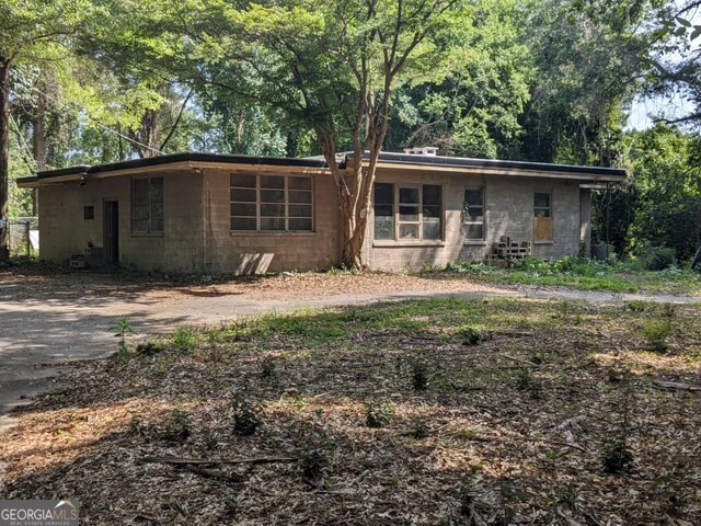 Attention Mid-Century Modern Enthusiasts! This is your chance to own 2 MCM homes designed by Bernard Webb, a noted Macon architect well known for his MCM designs. The homes are located on 3 private lots totaling 4.7 acres. Both homes have new roofs, but do require significant renovations. 1831 Upper River Rd was built by Marshall & Gertrude Daugherty. Mr. Daugherty was head of Mercer's art department for many years. His studio was located in the home. The home has walls of glass overlooking a kidney shaped pool and features many built-ins, an open floor plan, randomly shaped marble flooring, and a Generac generator. 1835 Upper River Rd was built in 1950 by Calder Payne, Macon Historian, as a one room retreat in the woods. Bernard Webb was later hired to design an addition. This home was referred to as "Persimmon Hill." This can be a unique private retreat, but convenient to downtown Macon and all it has to offer.