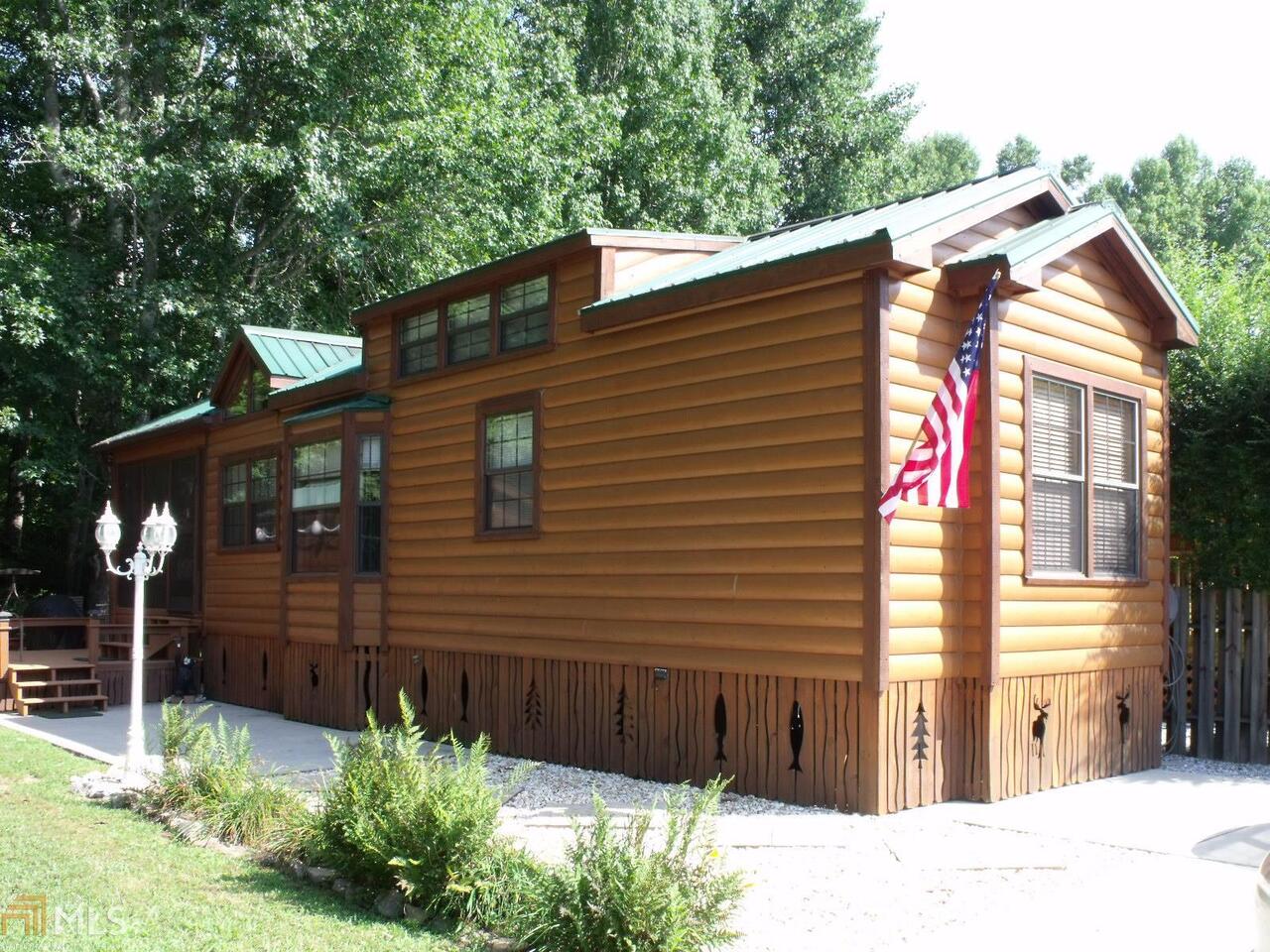 2 DEEDED RV LOTS 1 WITH A 2008 1 BEDROOM 1 BATH PARK CABIN WITH SLEEPING LOFT, OPEN KITCHEN FULL SIZE APPLIANCES DINING-LIVING ROOM WITH FIREPLACE, SCREENED PORCH, COMES FURNISHED AND READY TO USE, NICE DECK ALONG SIDE THE CREEK AND A SEPARATE STORAGE BUILDNG, 2ND LOT CAN BE USED FOR YOUR RV