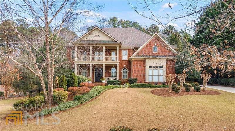 CREEKSTONE ESTATES! SOUTH FORSYTH'S MOST SOUGHT-AFTER NEIGHBORHOOD * TOP AMENITIES & ACTIVE LIFESTYLE Well-crafted 4-sided brick 6BR/5.5BA home makes entertaining enjoyable and easy with an open concept floor plan. The NEWLY RENOVATED gourmet kitchen features an oversized (over 6 ft x 10ft) island, new white cabinets, beautiful QUARTZITE STONE countertops, double ovens, gas cooktop and views into the 2-story great room which showcases built-in bookcases & a wall of windows allowing an abundance of natural light. The breakfast room has access to the covered deck andpergola where you can enjoy the privacy of your fenced back yard and greenspace. The palatial master suite features a sitting room, fireplace and double tray ceiling. Hardwood floors are found through the home. Access to the large deck from a secondary bedroom is found on the font of the home which adds character and charm to an already timeless exterior. The full finished basement offers a second kitchen, exercise room, media room, bedroom, full bathroom and was finished with quality materials offering texture and richness that matches the main levels of the home. This home is minutes away from Halcyon, the Avalon, the Greenway, downtown Alpharetta, Lake Lanier and hospitals providing versatility to your lifestyle. Creekstone Estates has some of South Forsyth's best amenities including tennis teams, tennis pros and swim teams for all ages. This home offers it all!