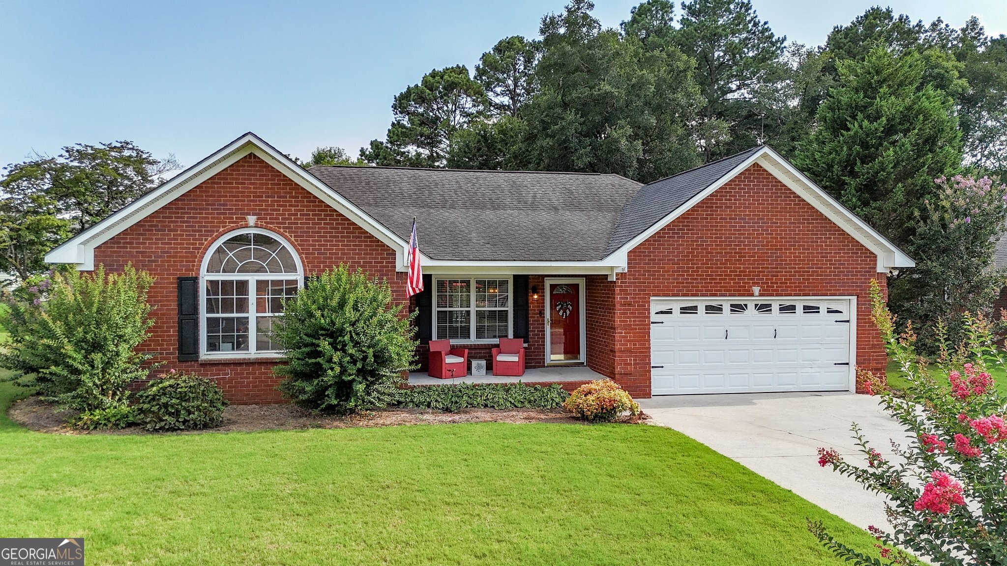 Discover refined living in this stunning all-brick ranch home, perfectly positioned just moments from shopping, dining, and the conveniences of downtown. Boasting four spacious bedrooms and two baths, this single-level masterpiece combines timeless elegance with modern sophistication. As you step inside, you are cheerfully welcomed by a neutral palette, soaring vaulted ceilings, and rich LVP flooring that flows effortlessly throughout the open-concept living spaces. The thoughtfully designed split-bedroom floor plan ensures both privacy and functionality, making it ideal for everyday living and practical entertaining. The primary suite is your own personal retreat, made complete with an elegant tray ceiling, expansive walk-in closet, as well as an inviting en-suite with a soaking tub, separate shower, and lovely finishes. All secondary bedrooms offer generous closet space and all the space you need for guests, family, or your home office. Outside, get ready to enjoy your own private escape featuring a flat, fully fenced and landscaped backyard, intimate sitting area, & an outbuilding perfect for additional storage or your next hobby. Don't miss your chance to own this move-in ready home with modern finishes and an unbeatable location!