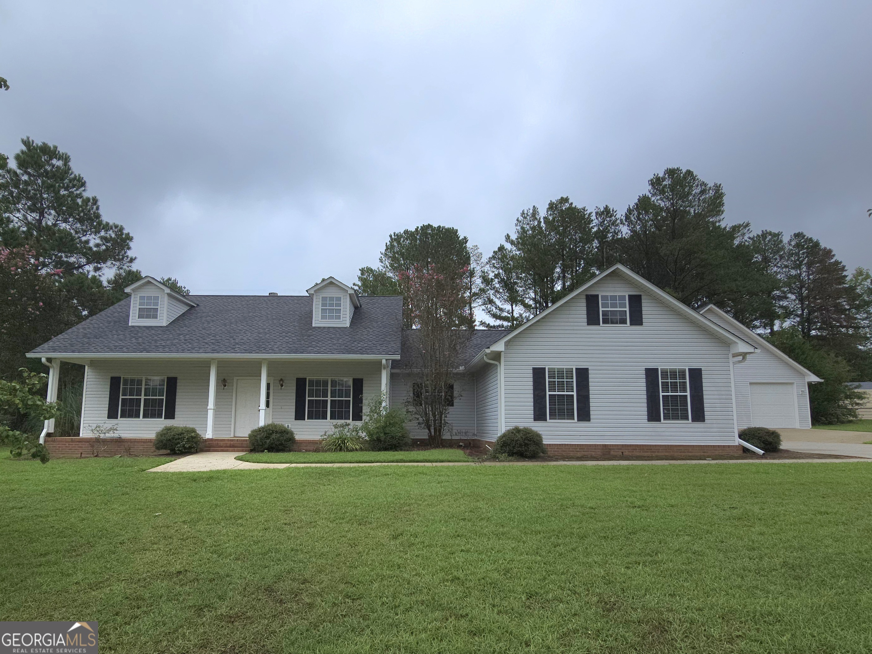 Opportunity knocks to own in the much desired Holly Hills II subdivision. With a little TLC this house will make an amazing home. Sellers are offering $10,000.00 towards paint and flooring. Sitting on almost a full acre of land, this home had it's roof replaced around 5 years ago. It's a spacious 3 bedroom 2 bath home with a large back porch that's screened in! Have you been dreaming of your own shop? Besides the 2 car side-load garage there's an additional 3 car detached garage! Yes! 5 cars could be in the garages! Come See if this is the opportunity you've been waiting on.