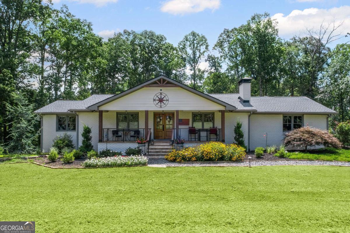 Perfect Ranch Home on Basement with 7.98 Acres - North Forsyth/South Dawsonville Welcome to your private oasis! This beautifully remodeled 5-bedroom, 4.5-bath ranch home on a full basement is nestled on nearly 8 acres in the highly sought-after North Forsyth/South Dawsonville area. Every inch of this home has been thoughtfully updated with top-of-the-line finishes and upgrades-making it truly move-in ready. Highlights Include: * Brand New Saltwater Pool with under decking, wired for landscape lighting * Climate-Controlled She Shed with two lean-tos - ideal for hobbies, a home office, or creative space * Spray Foam Insulation in both the house and she shed for optimal energy efficiency and comfort * Professional Landscaping with outdoor lighting enhancing the curb appeal * 50-Amp RV/Camper Hookup * Completely Remodeled Interior with an open-concept floor plan * Gourmet Kitchen featuring a stunning 14-foot island, high-end appliances, and all-white pine hardwood floors throughout the main level * Finished Basement with luxury vinyl plank (LVP) flooring * Two Master Suites with walk-in closets and custom shelving * Spa-like Master Bathroom with heated floors and oversized layout * 3-Car Garage + Additional Shop with Garage Bay * Ample Space for entertaining, storage, and comfortable everyday living * All Major Systems Updated: New roof, HVAC, water heaters, and more This home combines luxury, comfort, and privacy with modern farmhouse charm. Whether you're entertaining by the pool, relaxing in one of the spacious master suites, or working on a project in the shop, this property truly has it all.