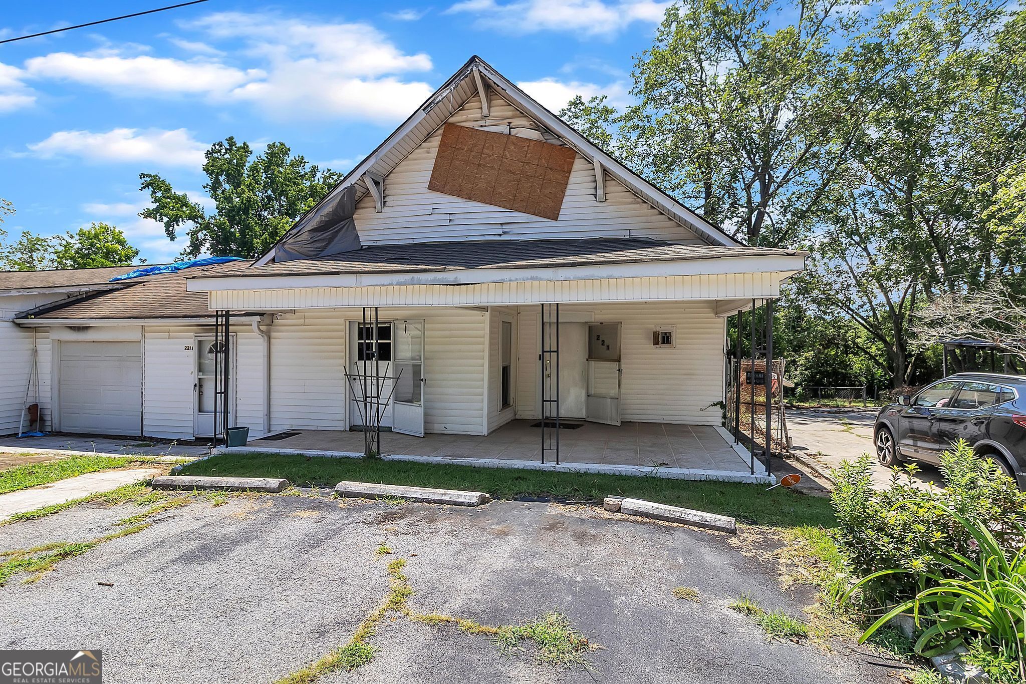 Investor's dream in Thomaston! This duplex at 221-223 Avenue L (Legal Description is 221 Avenue L) offers 5 bedrooms, 3 bathrooms, and 2,690 square feet with tremendous fix-and-flip potential. Both units need full renovation, making this the ideal project for buyers looking to add value and maximize returns. Unit 221 features 3 bedrooms, 2 bathrooms, and a one-car garage. Unit 223, previously used as a storefront, includes 2 bedrooms and 1 bathroom and can be restored as a residential unit or reimagined as a live-work or commercial space. In addition to the garage, the property provides five outdoor parking spaces-an uncommon feature that complements its mixed-use potential. The spacious backyard includes an in-ground swimming pool ready to be revitalized as a standout amenity. Please note: the laundry room sustained fire damage and will require repair as part of the renovation. Priced at just $80,000, this property sits well below area averages, where homes in the 30286 district sell near $200,000 with strong growth. Renovated duplexes in the Thomaston market can command resale values in the $345,000-$399,000 range, and rental demand supports strong long-term income potential, with area rents averaging $1,400 per unit monthly. With limited duplex inventory available, this property presents a rare opportunity to create significant value whether you hold as a rental, resell after renovations, or reimagine both units for maximum ROI.