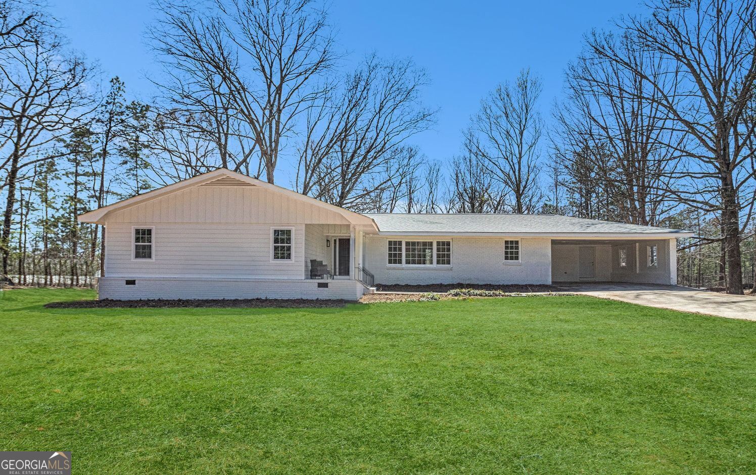 Welcome to 9640 Cedar Grove Rd in the heart of Chattahoochee Hills. This stunning 4-bedroom, 3-bathroom ranch home has been thoughtfully renovated, offering modern elegance and timeless charm on 2.6 private acres. With approx. 2,414 square feet of finished living space plus an additional approx. 1,830 square feet of unfinished basement, this home provides plenty of room to live, work, and grow. Step inside to an open-concept layout featuring luxury vinyl plank flooring, tile accents, and stylish finishes throughout. The kitchen boasts granite countertops, stainless steel appliances, a tile backsplash, and ample counter space. All four bedrooms are conveniently located on the main level, providing ease and comfort. This four-side brick home also includes a full unfinished basement, offering endless possibilities for additional living space or storage. Enjoy outdoor living with a spacious front porch, back deck, and covered patio, perfect for relaxing or entertaining. A 240-square-foot accessory dwelling unit (ADU) provides flexible space for guests, rental income, or a private office. Additional highlights include two fireplaces, a two-car garage, and a fenced backyard. Conveniently located near major highways, Serenbe, and all that Chattahoochee Hills has to offer, this home is a rare find blending modern updates with peaceful surroundings.