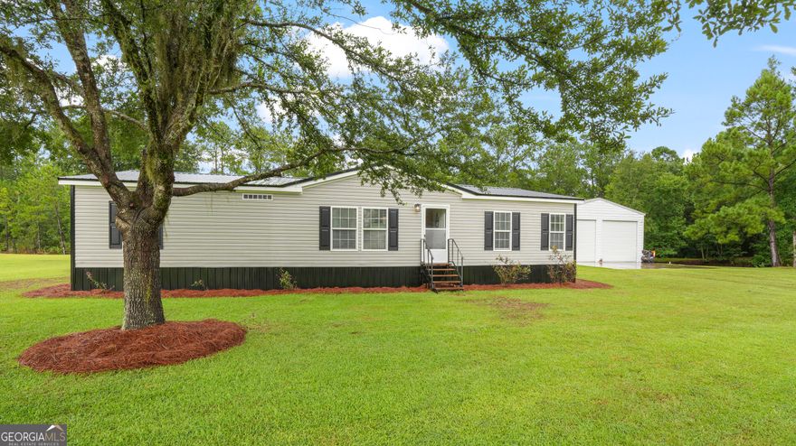 Seller offering $5,000 in Closing costs. Shellman Bluff Living - Pond, Shop, & Coastal Vibes! This isn't just a house - it's your ticket to the Bluff life! 3 bed, 2 bath | 2,016 sq ft | .82 acres with your very own pond and a massive 30x45 shop (water, power, 2 bay doors).  Here in golf-cart-friendly Shellman Bluff, you can cruise to the marina, grab fresh seafood, tee off on the awesome golf course at Sapelo Hammock, or just soak in those coastal breezes. Life moves slower here... and you'll love every minute.  Ready to live where every day feels like vacation? Let's talk.