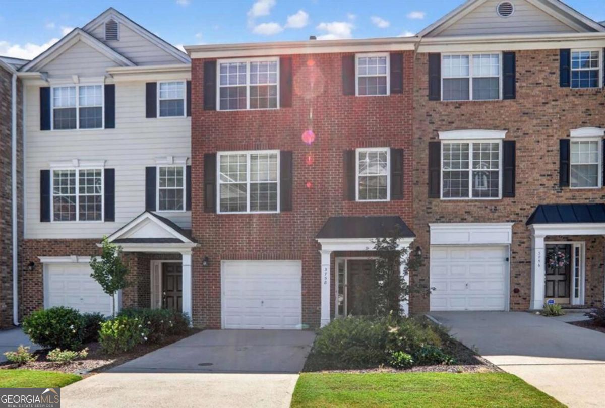 Welcome to a beautifully updated townhome where timeless elegance meets modern convenience. Rich, dark LVP flooring flows across the lower and main level with an elegant marble surround fireplace and designer feature wall anchoring the family room. The chef's kitchen boasting granite countertops, stainless steel appliances, gas range, and seamless access to the outdoor deck - perfect for entertaining or relaxing. Upstairs, all carpeted, the primary suite is a true retreat, with a spa-like bath featuring a massive tiled shower and rain shower head. Two oversized bedrooms can easily be reconfigured back to three bedrooms to suit your lifestyle (at the owners expense). Custom closets in all 3 bedrooms. The terrace level offers a versatile flex space for an office, guest suite, or den with with a stubbed bath for easy finishing. Luxe upgrades in all bathrooms, a newer hot water heater. Located in prestigious Chattahoochee Bluffs offers a vibrant lifestyle with access to the Chattahoochee National Park, miles of walking trails, a sparkling pool and clubhouse, fitness center, and an active community of neighbors. Enjoy the prestige of an Atlanta address with the financial advantage of low Cobb County taxes and no city tax-a rare blend of in-town living and unmatched value. This exceptional home combines luxury, convenience, and community in one of the best locations Atlanta has to offer. PREFERRED LENDER will contribute $2000 toward closing cost depending on the loan amount - call for details !