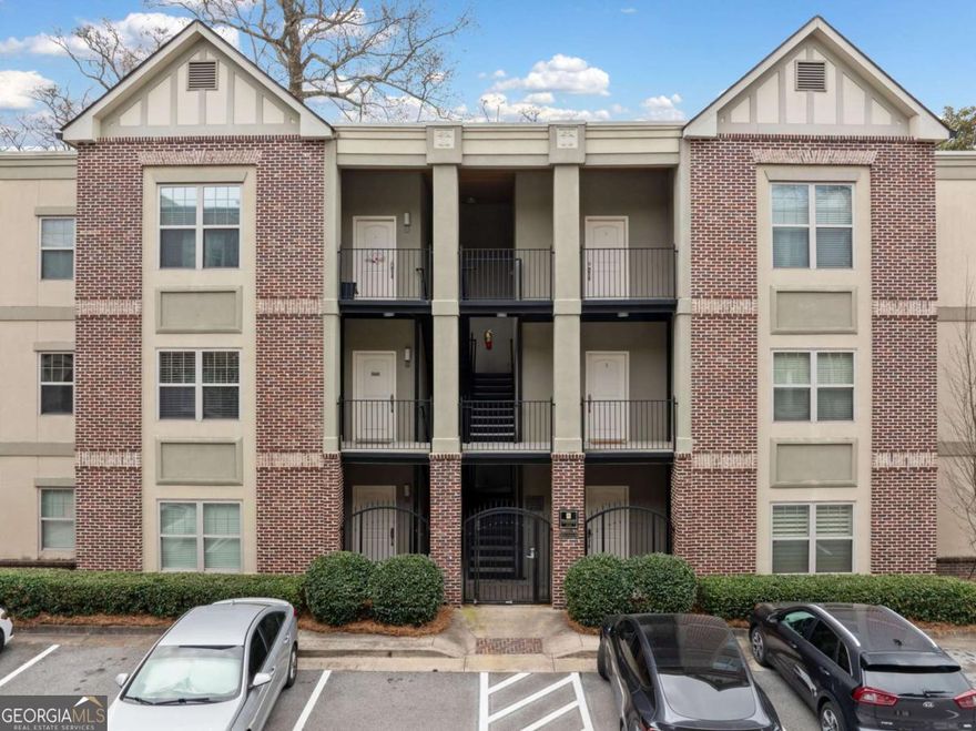 Modern Condo in a gated Westminster community in a prime location near shopping, dining, and major highways. The open-concept living space is flooded with natural light, featuring hardwood floors, high ceilings, and a seamless flow into the updated kitchen. Sleek dark cabinetry, granite countertops, stainless steel appliances, and pendant lighting over the breakfast bar create a contemporary feel perfect for entertaining. The primary suite is a true retreat with a spa-inspired bath boasting a double vanity, granite counters, and a walk-in shower with travertine tile. The bright secondary bedroom has built-in storage, closet and access to the full hall bath. A private covered balcony with tree-lined views provides the perfect spot to unwind. Located just minutes from Buckhead and Midtown dining, Piedmont Hospital, and the scenic Beltline Trail. With Tanyard Creek Park as your backyard, nature and city life blend seamlessly!