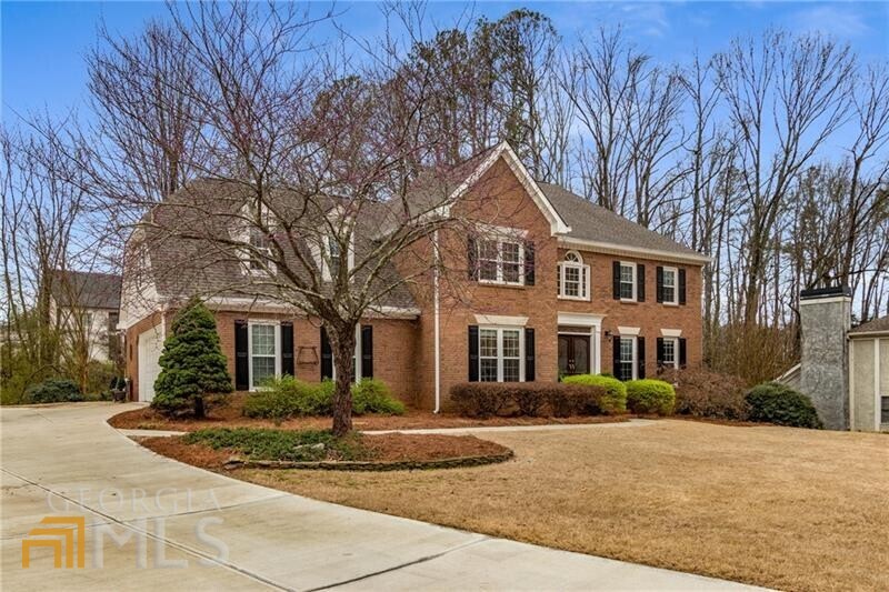 Welcome home to this classic and traditional, updated beautiful brick home in the Lake Windward Community in Alpharetta. This charming home offers the best of indoor and outdoor living. Incredible curb appeal with level, and landscaped front yard. New concrete driveway and space for multiple cars. The flat and level, dreamy backyard also is lush with manicured landscaping for summer green screen, and has plenty of room for future pool. Perfect spot for entertaining! You will notice the back deck is only a few steps off of the green grass , and has upgraded Trex flooring. Connected is an oversized, relaxing and peaceful, screened in porch. Firepit and tv are perfect for those fall evenings and watching your favorite sport events. Favorite spot in the house so don't miss! Upon front entry, two-story foyer opens to formal dining room on left and flex space for office or living room on right. Interior newly painted with neutral colors, windows offering much natural light, hardwoods through out main level, second level and staircases. Newly renovated designer chef kitchen with gas range, white cabinetry, gorgeous stone counters, and designer subway tile. Soothing and in trend colors. Bonus is there is a 2cd staircase off of kitchen/garage to upstairs bedrooms. Family room is open and spacious and very inviting! Gas fireplace,and logs, large windows offering abundant natural light, and wet bar. Family room flows to kitchen through barrel style archway, providing open concept feeling while allowing room for a bit of privacy too. Screened in porch off of family room for outdoor living convenience. Oversized upstairs Master Bedroom with en suite master bath. Over sized walk in shower, jetted tub, double vanity, and linen closet. Master offers Spacious His and her style closet. 3 guest bedrooms upstairs . Basement offering "man cave" and plenty of space to entertain or add your personal touch in empty unfinished area. Fun space for gaming, tv, playing pool and hanging out. Tons of storage space and work bench area for the craftsman. Exterior door opens to backyard. Lots of upgrades! Newer roof and gutters 2017, Newer exterior doors and garage door, 1st floor and up windows replaced in 2005, Newer cement siding 2017, Upstairs hardwoods added in 2017, Kitchen renovation 2020, replaced builder grade trim with bigger profiles and baseboards, new driveway 2021, water heater replaced 2021, fresh interior paint 2022. This is the home you have been waiting on! Loved and cared for! Truly a special home. Lake Windward community offers residential living at its finest. This master planned community boasts a 200-acre lake offering boating, kayaking, paddle boarding, fishing, soccer fields and playgrounds. This prestigious community is also home to privately owned Golf Club of Georgia and Windward Lake Club offering many amenities (tennis, pickle ball, multiple pools, sport parks) and optional memberships. More info at Windwardcommunity.org