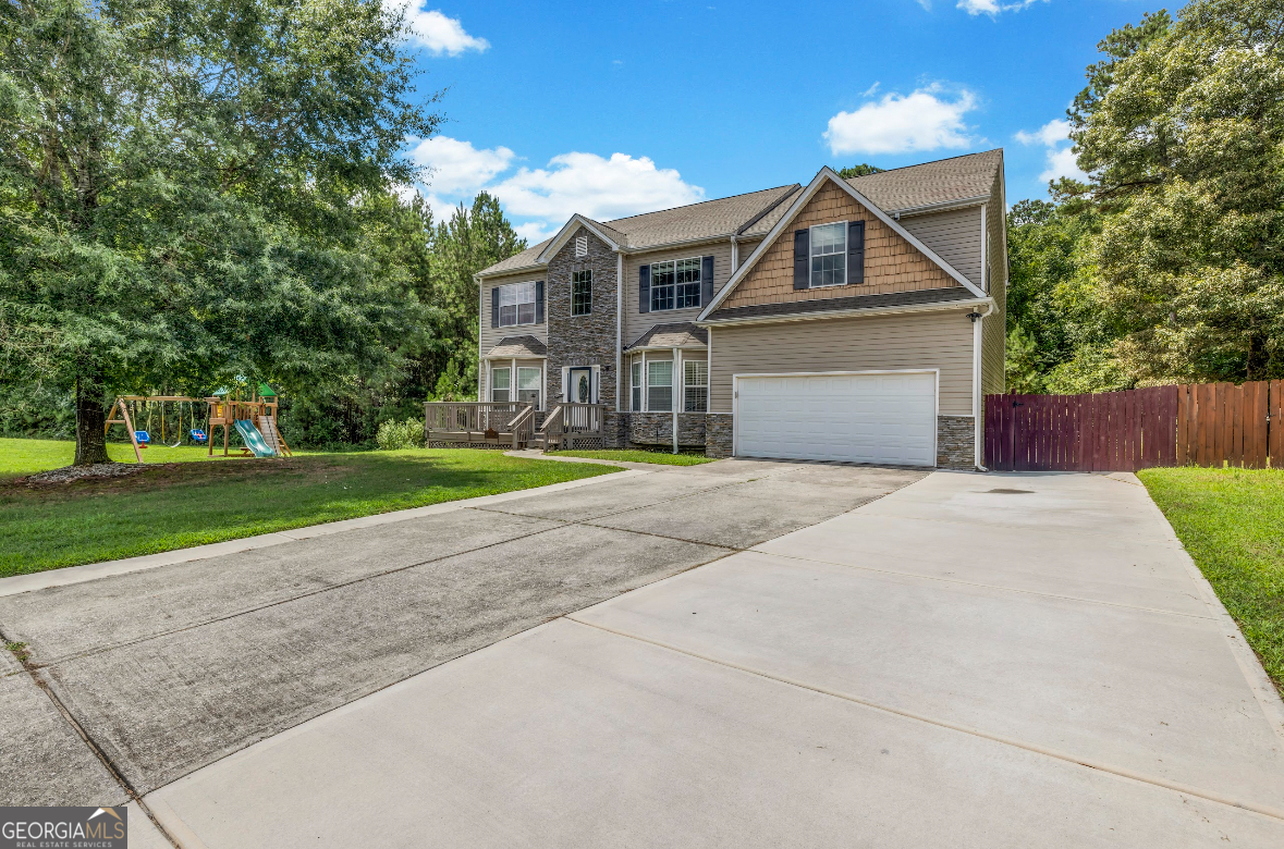 Beautiful 5-bedroom /3.5-bath home with full finished basement & endless space for living, working, and entertaining! Main level features formal living & dining rooms, a private office with French doors, a half bath, and a spacious family room with a cozy fireplace. The kitchen is complete with stainless steel appliances, upgraded cabinets & fixtures, a wine fridge & a large island perfect for gatherings & meal prep. Luxury vinyl flooring runs throughout the entire home-including the stairs-and there is no carpet anywhere! Large bedrooms on 2nd floor, including an oversized owner's suite with French doors, one of the largest sitting areas you've ever seen, a walk-in closet & a spa-like bath with soaking tub, separate shower & dual vanities. One of the secondary bedrooms has its own private en-suite bathroom and the remaining secondary bedrooms are generously sized with walk-in closets. Finished basement offers incredible versatility with one bedroom, 3 additional bonus rooms ideal for extra bedrooms, offices, or recreational use, a full bathroom & a second full kitchen with a stove, fridge, and sink. Enjoy a large front deck, large fenced backyard with an oversized back patio and deck, and a 2 yr old swim spa. Laundry room with washer & dryer included This home is total electric, NO HOA and no rental restrictions. With private entrance, full bath and kitchen in basement - this space is perfect for multigenerational living, in-law suite or various rental/ income-producing opportunities. Extended/Widened driveway. Roof replaced 2023. Some photos have been virtually staged to reflect space potential.