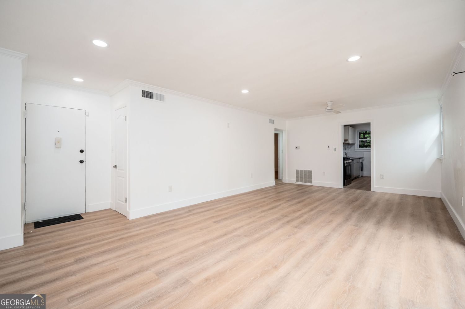 Step into this fully renovated 2-bedroom, 1-bath condo where thoughtful upgrades meet timeless style. Perfectly positioned between South Buckhead and North Midtown, this unbeatable location puts you just minutes(-10)from GA Tech, SCAD, Piedmont Hospital, and offers effortless access to both I-75 and I-85. You're also steps from the Northwest BeltLine Trail, parks, golf, and tennis. Inside, you'll be greeted by an abundance of natural light pouring through dramatic floor-to-ceiling windows in the living room, which opens to a spacious walk-out balcony-ideal for grilling or unwinding after a long day. The brand-new kitchen stuns with English-style flat panel cabinetry, stylish finishes, stainless steel appliances, and a gas range built for serious cooking. Additional updates include new luxury vinyl plank flooring, modern lighting, and sleek fixtures throughout. The brand new bathroom offers luxury when it counts. Whether you're looking for the perfect in-town residence or a high-demand rental, this condo delivers on style, comfort, and location. Don't miss it! LOCATION, RENOVATION, VIBE- this home has it all, come see for yourself!
