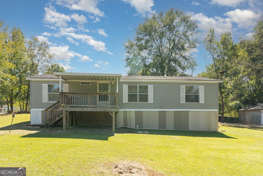 Charming 3 Bedroom Home with Lake Access - No HOA!   Welcome to this well-maintained 3 bedroom, 2 bath home that combines comfort, convenience, and plenty of extra space. Step inside to find new kitchen flooring and spacious closets. Outside, you'll love the nice-sized fenced lot, perfect for kids, pets, or entertaining. A huge 2-car garage provides ample parking and workshop space, while two large storage sheds offer even more room for hobbies, tools, or seasonal items.  Best of all, this property includes lake access, giving you the opportunity to enjoy fishing, boating, or peaceful evenings by the water-all without the restrictions of an HOA.  This home truly has it all: comfort, functionality, and lifestyle. Don't miss your chance to make it yours!
