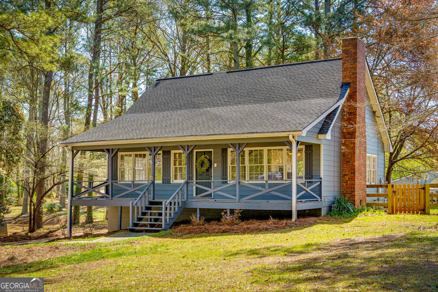 Charming and thoughtfully updated Cape Cod-style home on a spacious corner lot in Canton, GA, with easy access to both downtown Woodstock and downtown Canton. With a welcoming rocking chair front porch and a bright, open floor plan, this move-in ready home offers both character and modern convenience. Inside, you'll find an updated kitchen featuring white cabinetry, quartz countertops, subway tile backsplash, stainless steel appliances, and modern lighting. LVP flooring runs throughout the entire home, and the layout includes two bedrooms and a full bath on the main level, plus two additional bedrooms and another full bath upstairs - offering flexible space for shared living, guests, or a home office. The roof, HVAC, and water heater have been updated in recent years. The garage is a tandem-style two-car setup: one side fits vehicles, while the other works well for storage, tools, or hobbies. A fully fenced portion of the backyard offers a secure space for pets or play, and the peaceful, established neighborhood gives you that tucked-away feel without losing convenience. Just minutes from schools, shopping, restaurants, and both town centers - this one checks all the boxes for location, updates, and value. Come see for yourself what makes this home so special. Schedule a visit and discover the space and updates that make it a great place to call home. *Please note: Some photos feature virtual staging.