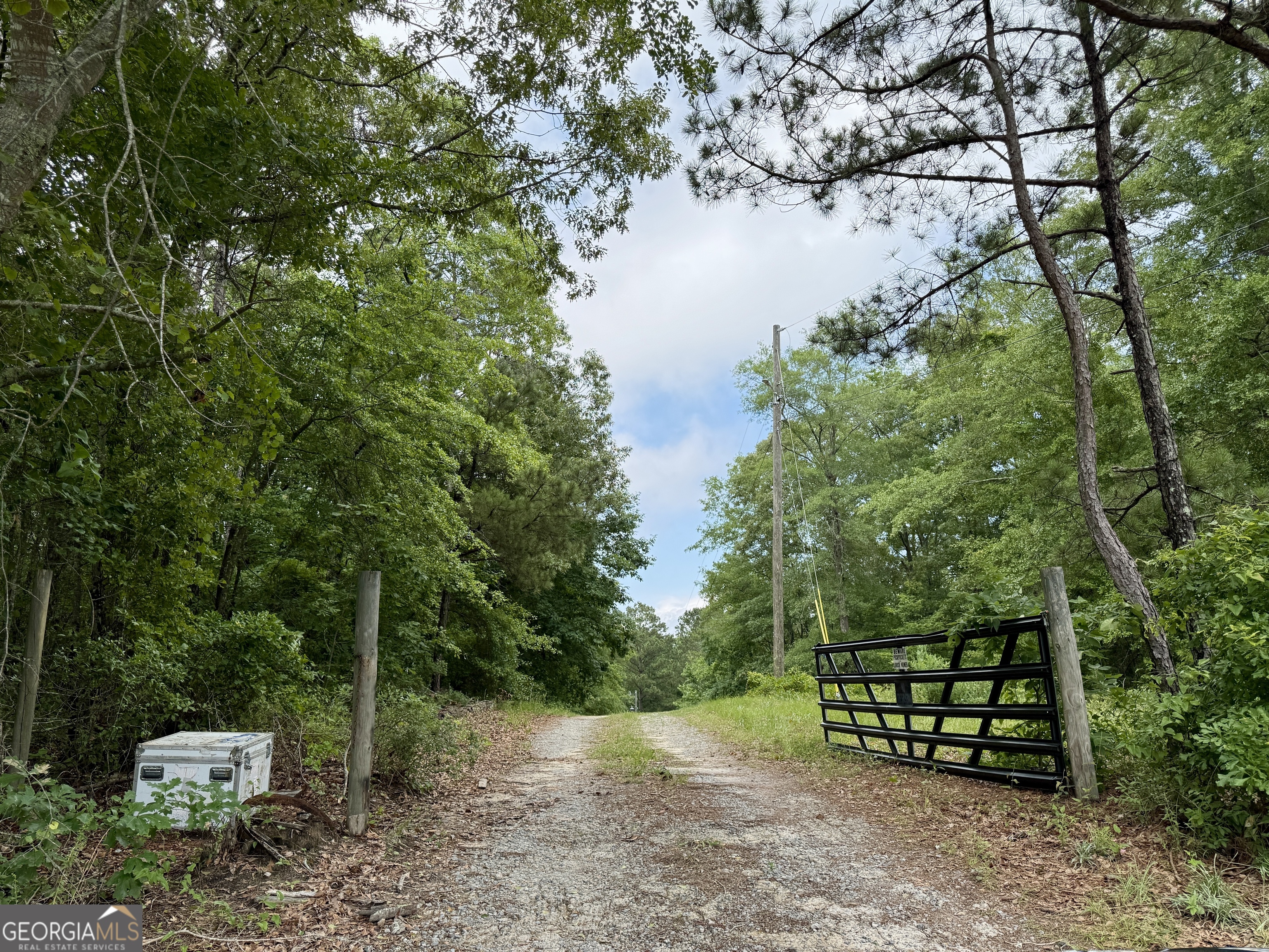 Over 9.5 Acres with a freshwater spring-fed pond in Jones County, this wooded lot is ideal for homesteading! Concrete foundation still exists where a former house was located. Well water, septic and electricity are all available. Barn with a loft and metal roof is onsite. Living soil system with leeks, potatoes, squash and other vegetables are established, as well as a compost area. Nutrient rich soil with a beautiful tree canopy, chantarelle mushrooms, muscadine vines, and several gardens are on the property. If you'd like to live off-grid, this is the ideal location to inhabit. Or a new home can be built to your specifications. Owner may be willing to subdivide, as three Parcels are being sold together under one listing. Schedule your showing today!