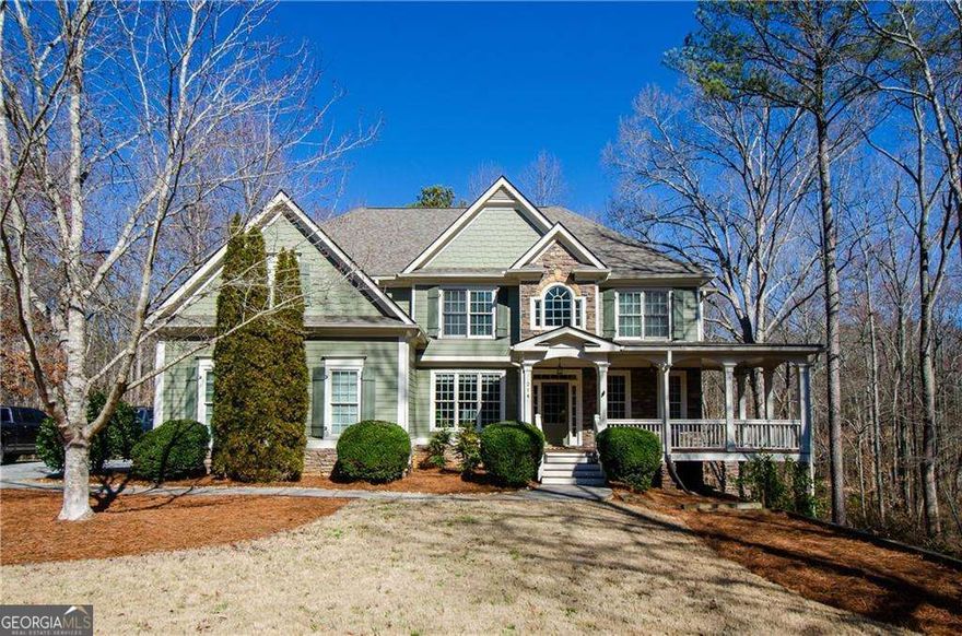 Spacious and Bright, 5 Bedroom/4 Bath Executive Home on over 1.5 acres combines convenience and serenity in Ball Ground.  Open Concept Layout with room to grow, just waiting for your personal touch. Chef's Kitchen comes complete with an expansive island, double ovens, walk-in pantry, open to Breakfast and Fireside Family Room.  Formal Dining Room, Office, Bedroom and full bath on the main level.  Upstairs includes the Primary Suite, an additional 3 spacious secondary bedrooms with generous closet space, bathroom and laundry room.  Full, finished, daylight, terrace level with separate entrance - Abundant Flex space for Media, Exercise, in-law suite or PlayRoom. Situated on a Private cul de sac, enjoy quiet and tranquility from the Rocking Chair Porch, surrounded by mature trees. Enjoy a Private backyard Oasis, with a deck, Patio and expansive woods for exploring.  2 car garage. Warm and established friendly HOA neighborhood of fine homes with a pool and playground.  Top Rated and Award Winning Creekview High School. Convenient to Shopping, Dining, Parks, & Hospitals. Easy Access to 20 and 575.
