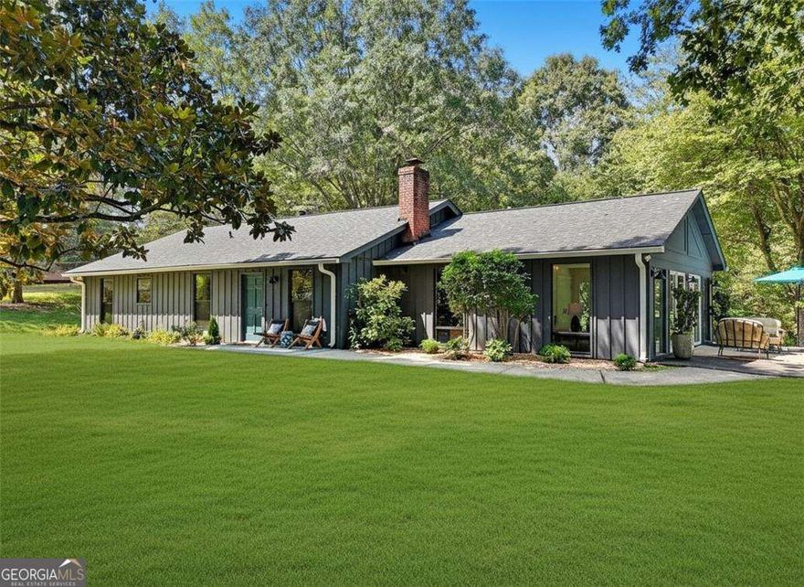 You will LOVE this rare Retreat at 789 Cardinal Cove! Sitting on 3 quiet acres with seasonal views across the street from Lake Cherful in the sought-after Mountain Park community. This beautifully renovated step-less Ranch home with detached garage and an RV parking pad offers a rare combination of space, flexibility, and lake-life charm with no HOA and low Cherokee County taxes. Step inside to find a thoughtfully and beautifully renovated Ranch with 2 bedrooms and a Den/convertible to a 3rd bedroom, 2 renovated full baths, newer kitchen, newer roof, new windows, new flooring, updated electrical and plumbing and fresh interior and exterior paint blending modern finishes with classic comfort. Outside, the property also shines: the home sits privately back from the road and up a gentle, long new concrete drive, the acreage is lush and level as you come up the drive and the large detached garage currently serves as an art studio yet could easily transform into a guesthouse, in-law suite, or income-producing Airbnb. For those with RV's, trailers or boats, you'll LOVE the dedicated RV parking pad which could also be a unique Airbnb. Enjoy the serenity of your own acreage while being only moments from the water-perfect for fishing, kayaking, or relaxing by the lake. With Mountain Park's unique, historic small-town vibe, abundant nature, community events like Oktoberfest and July 4th fireworks over the lake and easy access to Woodstock, Roswell, and Atlanta, this property is an ideal blend of retreat and convenience. Whether you're dreaming of a private homestead, artist retreat, multigenerational living, or a creative investment, 789 Cardinal Cove is a rare find with endless possibilities. Airstream is also being offered for sale. Call for a private showing today!