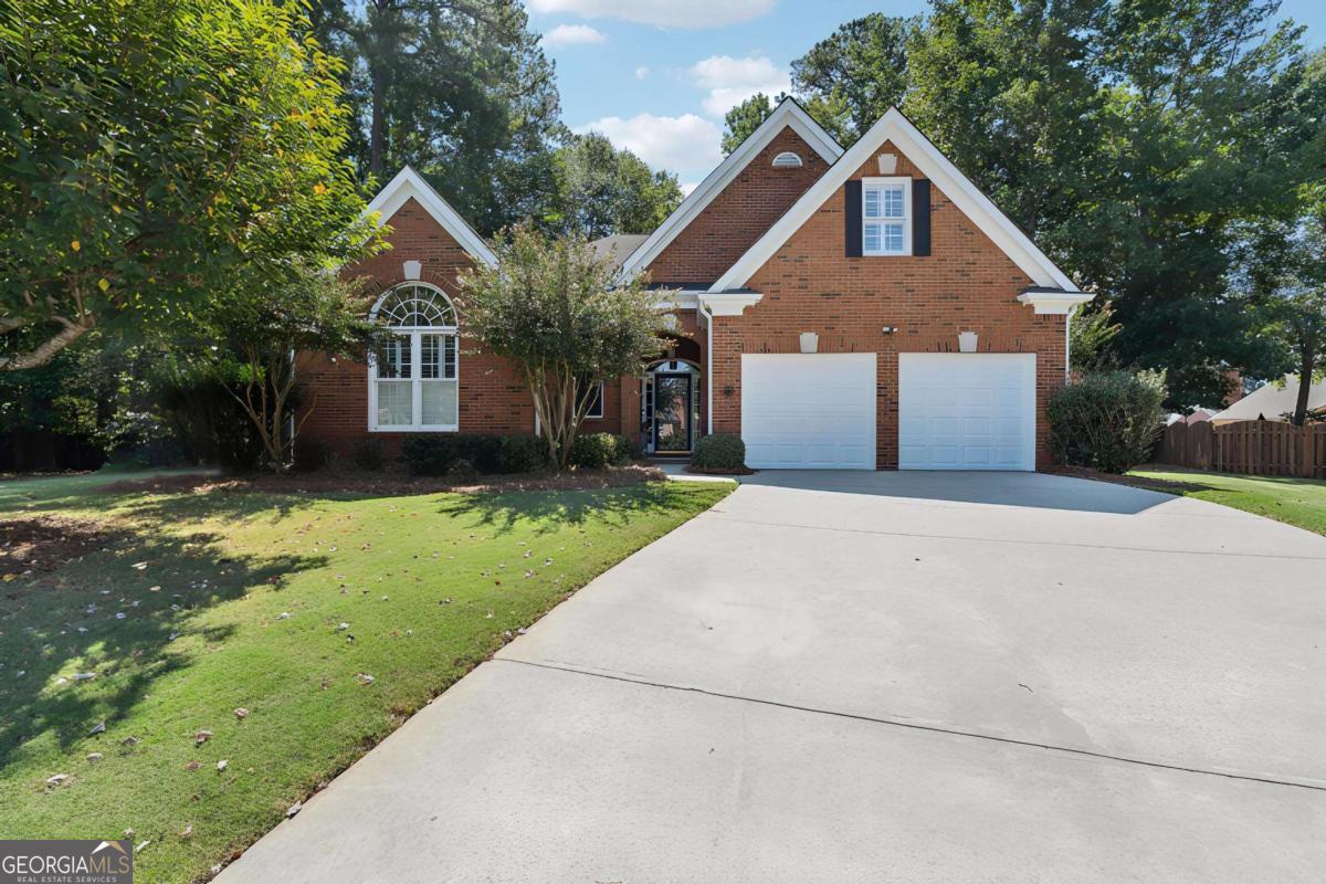 Just Listed in Johns Creek - America's #1 City to Live! Welcome to this beautifully updated 4-bedroom, 3-bath brick ranch nestled on a quiet cul-de-sac lot in the highly sought-after Medlock Bridge subdivision, located in the award-winning Johns Creek school district. This home perfectly blends timeless charm with modern updates, offering an open floor plan designed for today's lifestyle. Step inside to find a light-filled living space with updated fixtures, a white eat-in kitchen featuring modern appliances, and a seamless flow into the sunroom addition-a perfect spot to relax and take in the serene backyard views. The primary suite is thoughtfully separated from the secondary bedrooms, providing a private retreat. Upstairs, an oversized fourth bedroom doubles as a bonus room with its own private bath-ideal for guests, a home office, or a media room. Enjoy the privacy of a beautifully landscaped lot while being just minutes from shopping, dining, parks, and all that Johns Creek has to offer. With its unbeatable location, desirable floor plan, and stylish updates, this home truly checks every box.