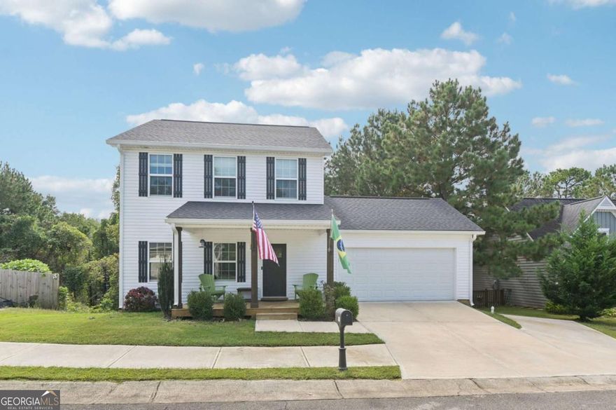 Gorgeous Home Near Historic Downtown Ball Ground! Just a mile from shops and dining, this home offers bright, inviting spaces with plenty of charm. A classic Southern-style front porch welcomes you inside to beautiful, low-maintenance laminate wood floors that flow throughout the main level living areas. The living room is light-filled, while the on-trend kitchen features granite countertops, a tile backsplash, large island with seating, apron-front farm sink, and pantry. A sunny breakfast room overlooks the private wooded backyard. A laundry room and half bath complete the main floor. Upstairs, the primary suite is a true retreat with dual sinks, granite counters, a walk-in shower, and spacious walk-in closet. Two additional bedrooms and a full bath ensure room for everyone! The newly finished basement is a fantastic bonus, offering a large multipurpose room-perfect for a media room, home office, or playroom-plus a bedroom and full bath. Enjoy outdoor living in the private backyard, complete with a large deck for grilling and entertaining, all surrounded by mature trees. With its prime location less than a mile from historic downtown Ball Ground, this home combines modern comfort with small-town charm. Book your tour today!